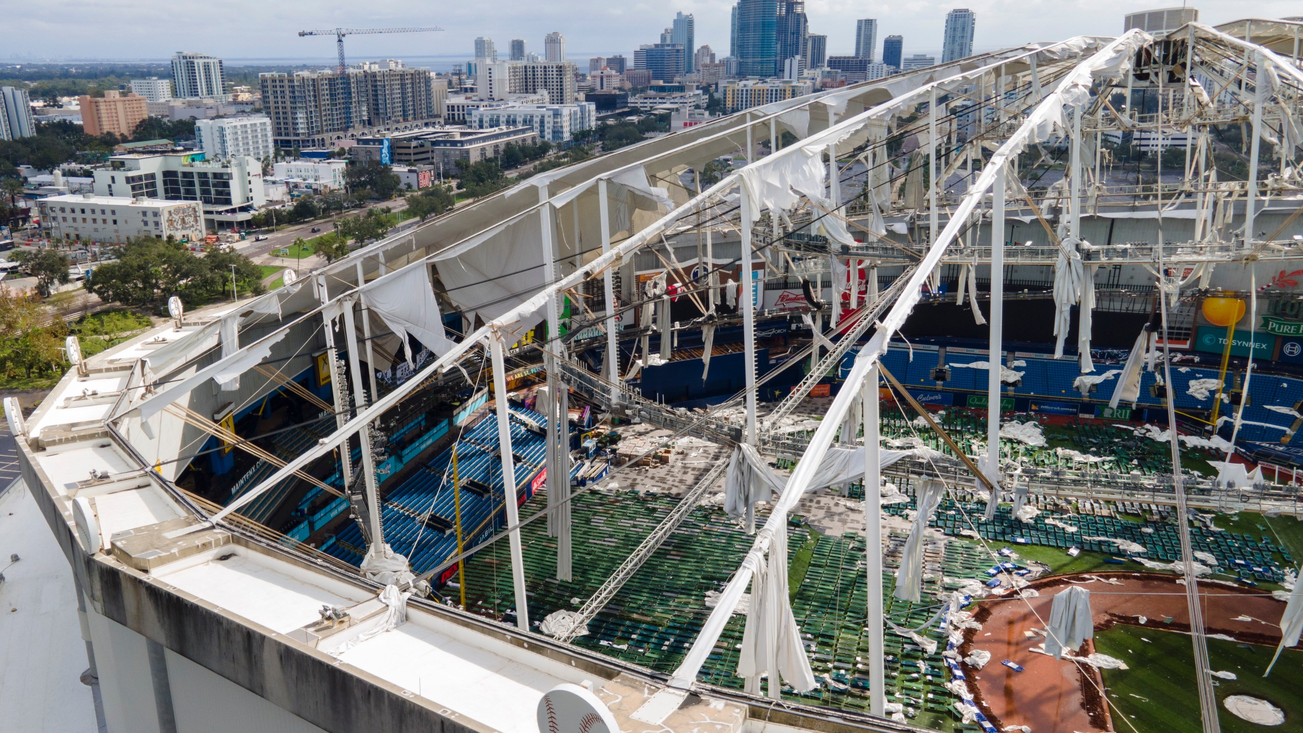 The roof of the Tropicana Field is damaged the morning after Hurricane Milton hit the region, Thursday, Oct. 10, 2024, in St. Petersburg, Fla. (AP Photo/Julio Cortez)