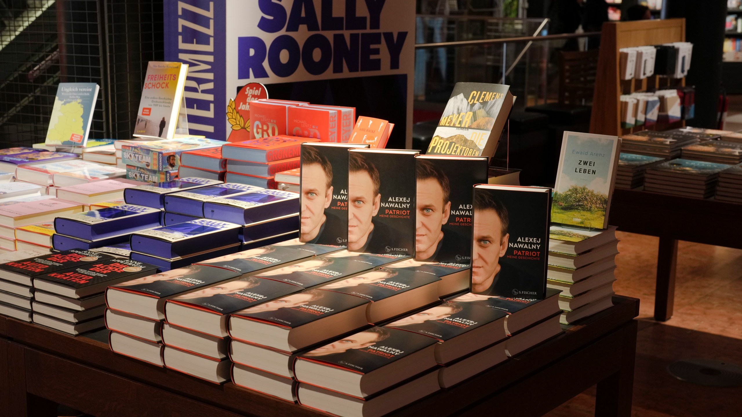 Copies of the late Russian opposition leader Alexei Navalny's memoir entitled 'Patriot' are put display on the first day of sale in a bookshop in Berlin, Germany, Tuesday, Oct. 22, 2024. (AP Photo/Markus Schreiber)