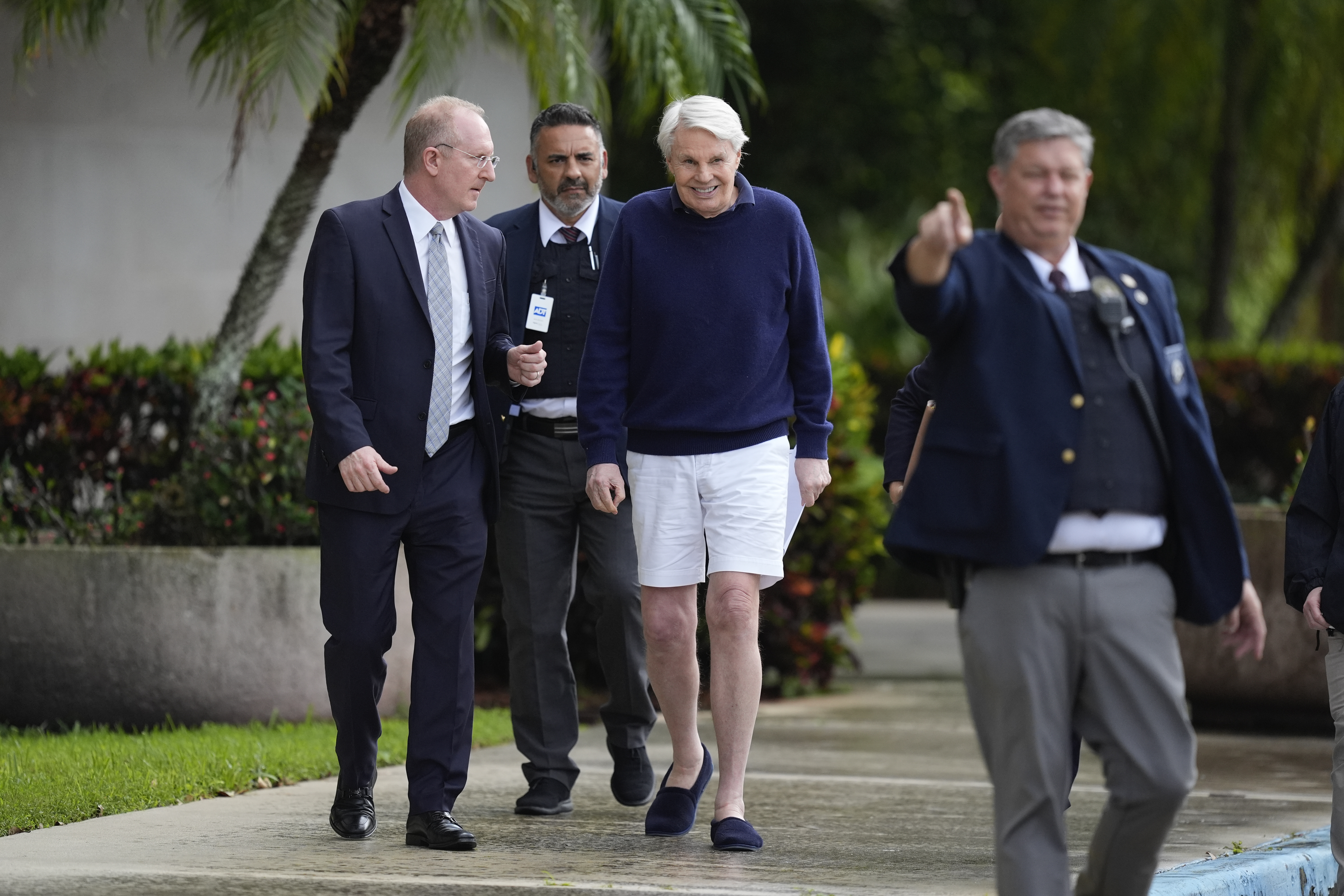 Michael Jeffries, center, former CEO of Abercrombie & Fitch, leaves with his attorney Brian Bieber, left, following a hearing at the Paul G. Rogers Federal Building and U.S. Courthouse in West Palm Beach, Fla., Tuesday, Oct. 22, 2024. (AP Photo/Rebecca Blackwell)