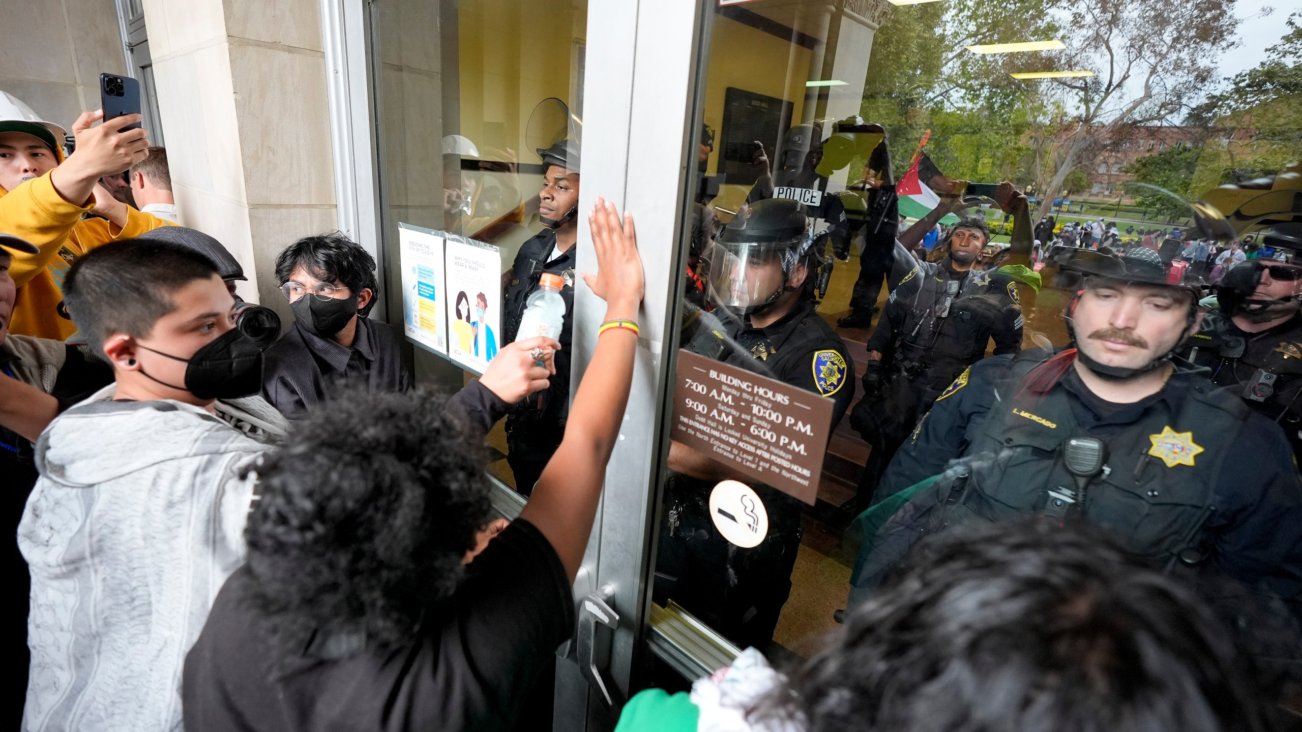 FILE - Police block pro-Palestinian demonstrators from entering a building on the UCLA campus, May 23, 2024, in Los Angeles. (AP Photo/Ryan Sun, File)