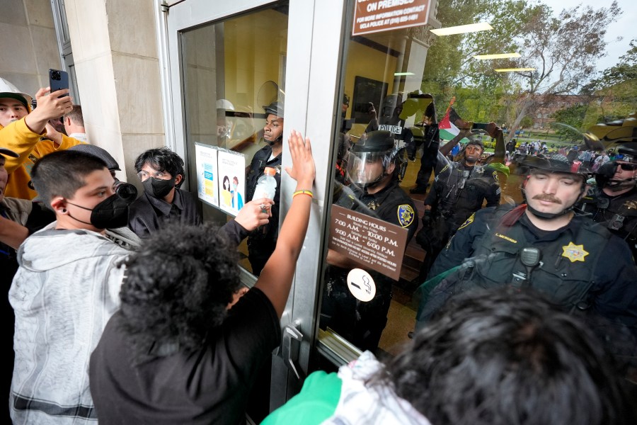 FILE - Police block pro-Palestinian demonstrators from entering a building on the UCLA campus, May 23, 2024, in Los Angeles. (AP Photo/Ryan Sun, File)