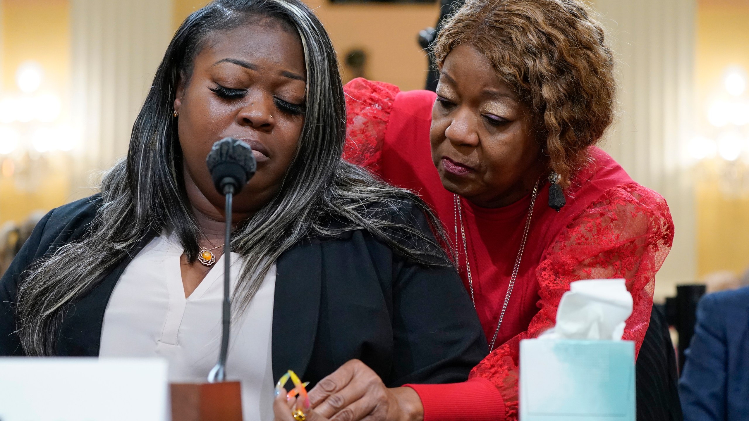 FILE - Wandrea "Shaye" Moss, a former Georgia election worker, is comforted by her mother, Ruby Freeman, right, as the House select committee investigating the Jan. 6 attack on the U.S. Capitol continues to reveal its findings of a year-long investigation, at the Capitol in Washington, June 21, 2022. (AP Photo/Jacquelyn Martin, File)