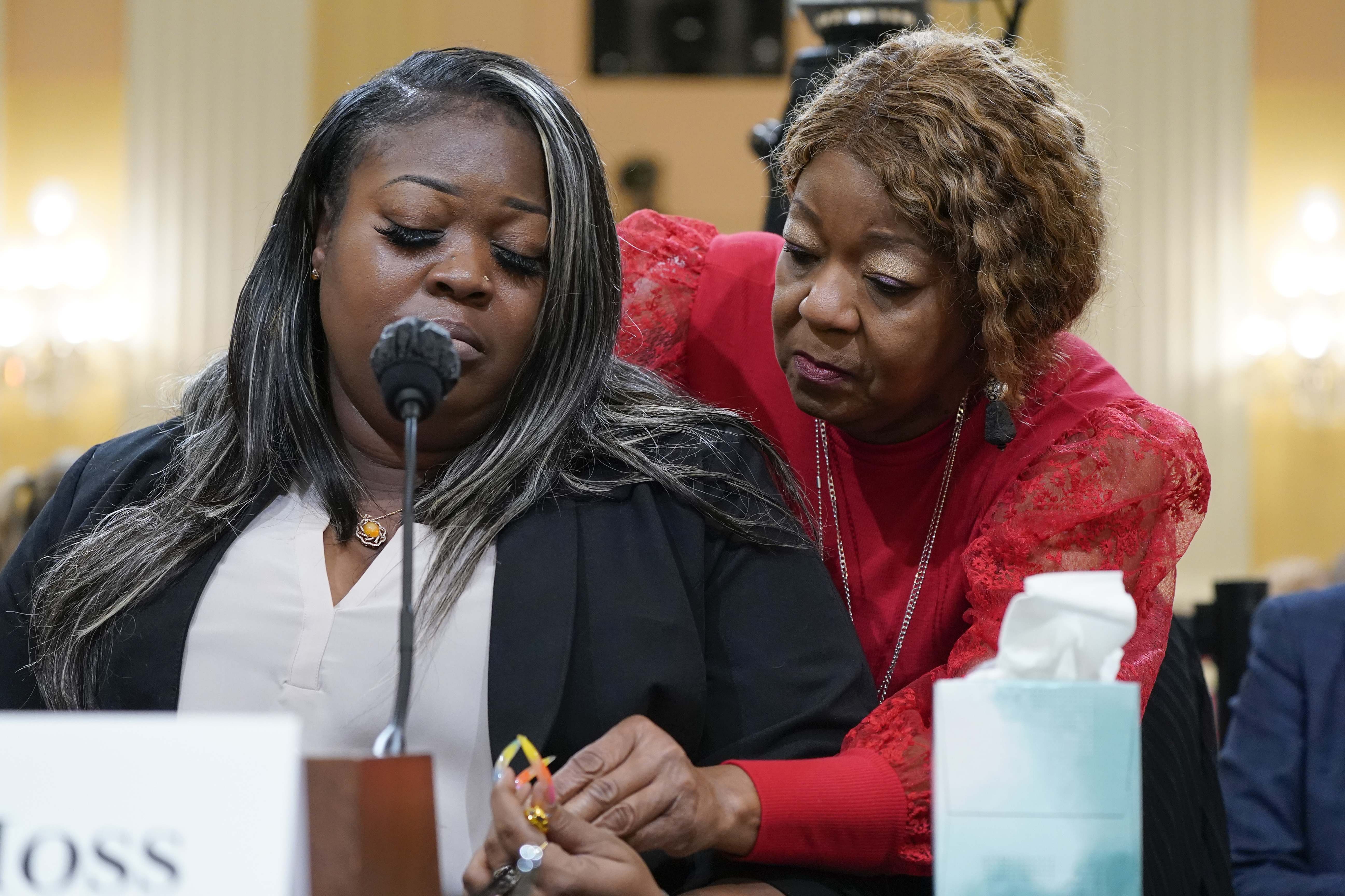 FILE - Wandrea "Shaye" Moss, a former Georgia election worker, is comforted by her mother, Ruby Freeman, right, as the House select committee investigating the Jan. 6 attack on the U.S. Capitol continues to reveal its findings of a year-long investigation, at the Capitol in Washington, June 21, 2022. (AP Photo/Jacquelyn Martin, File)