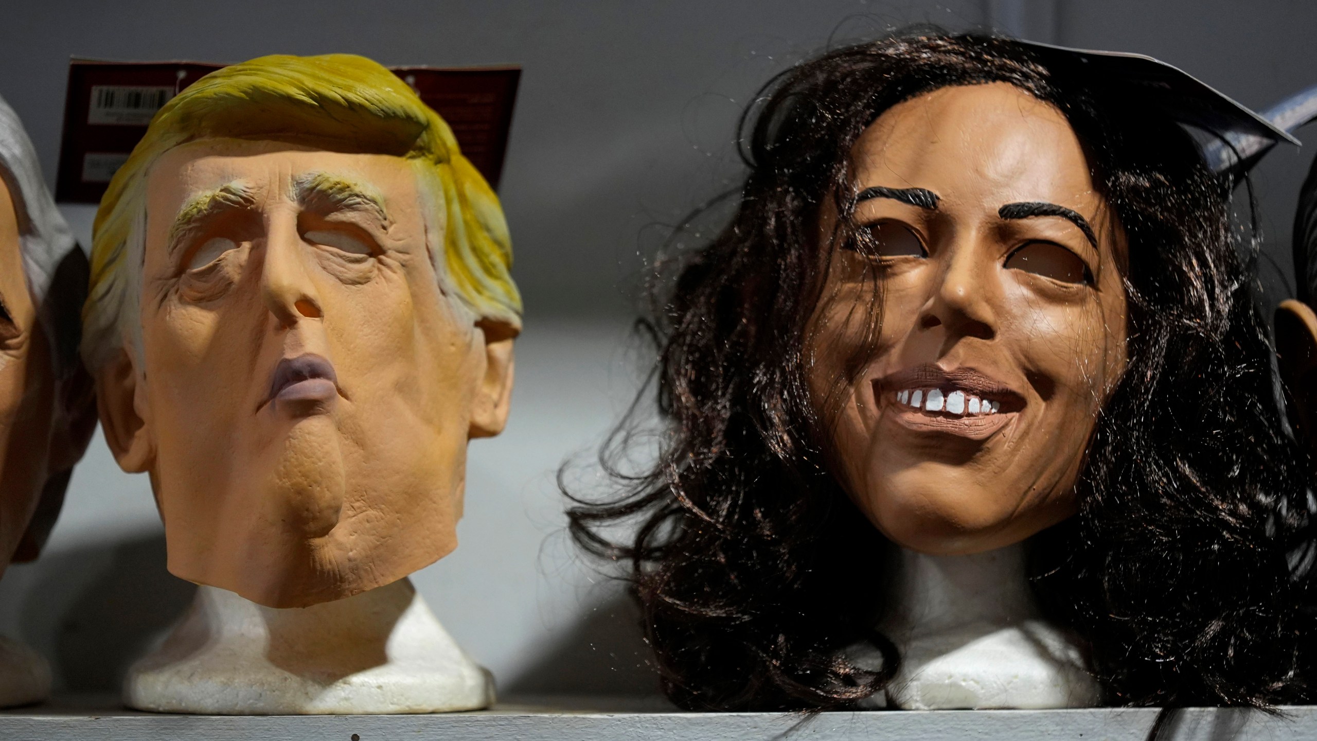 Masks of Republican presidential nominee former President Donald Trump and Democratic presidential nominee Vice President Kamala Harris are seen on display at The Theatrical Shop, Tuesday, Oct. 29, 2024, in West Des Moines, Iowa. (AP Photo/Charlie Neibergall)