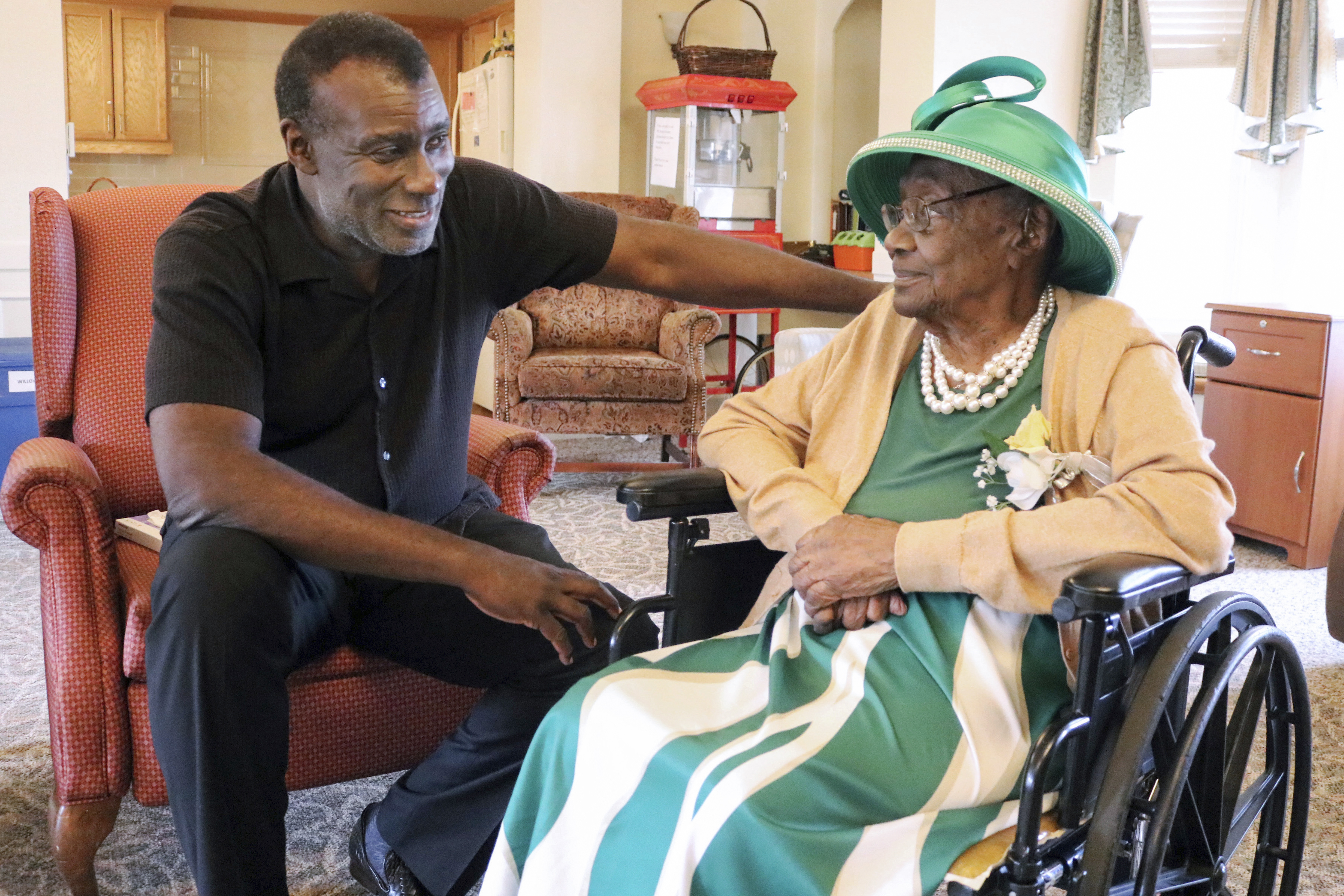 Dan Whitehead chats with his grandmother, Naomi Whitehead, at St. Paul's Senior Living Community in West Salem Township, Pa., in Sept. 2023. (Michael Roknick/The Herald via AP)