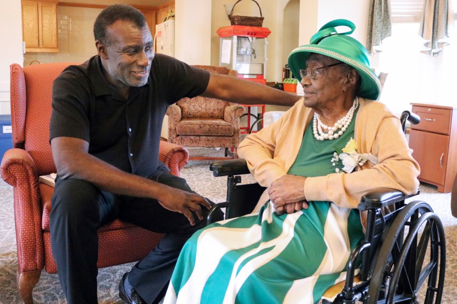 Dan Whitehead chats with his grandmother, Naomi Whitehead, at St. Paul's Senior Living Community in West Salem Township, Pa., in Sept. 2023. (Michael Roknick/The Herald via AP)