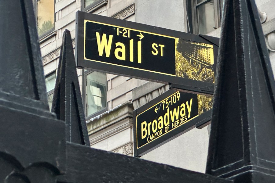 A sign marking the intersection of Wall Street and Broadway in New York's Financial District is shown on Wednesday, Oct. 30, 2024. (AP Photo/Peter Morgan)