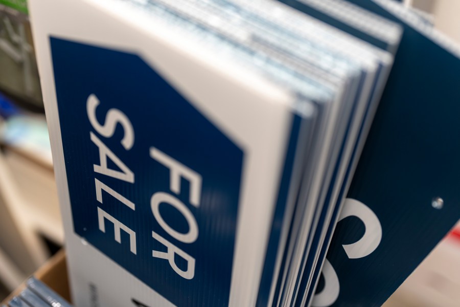 For sale and sold signs are seen in storage at a real estate office on Tuesday, Oct. 15, 2024, in Portland, Ore. (AP Photo/Jenny Kane)