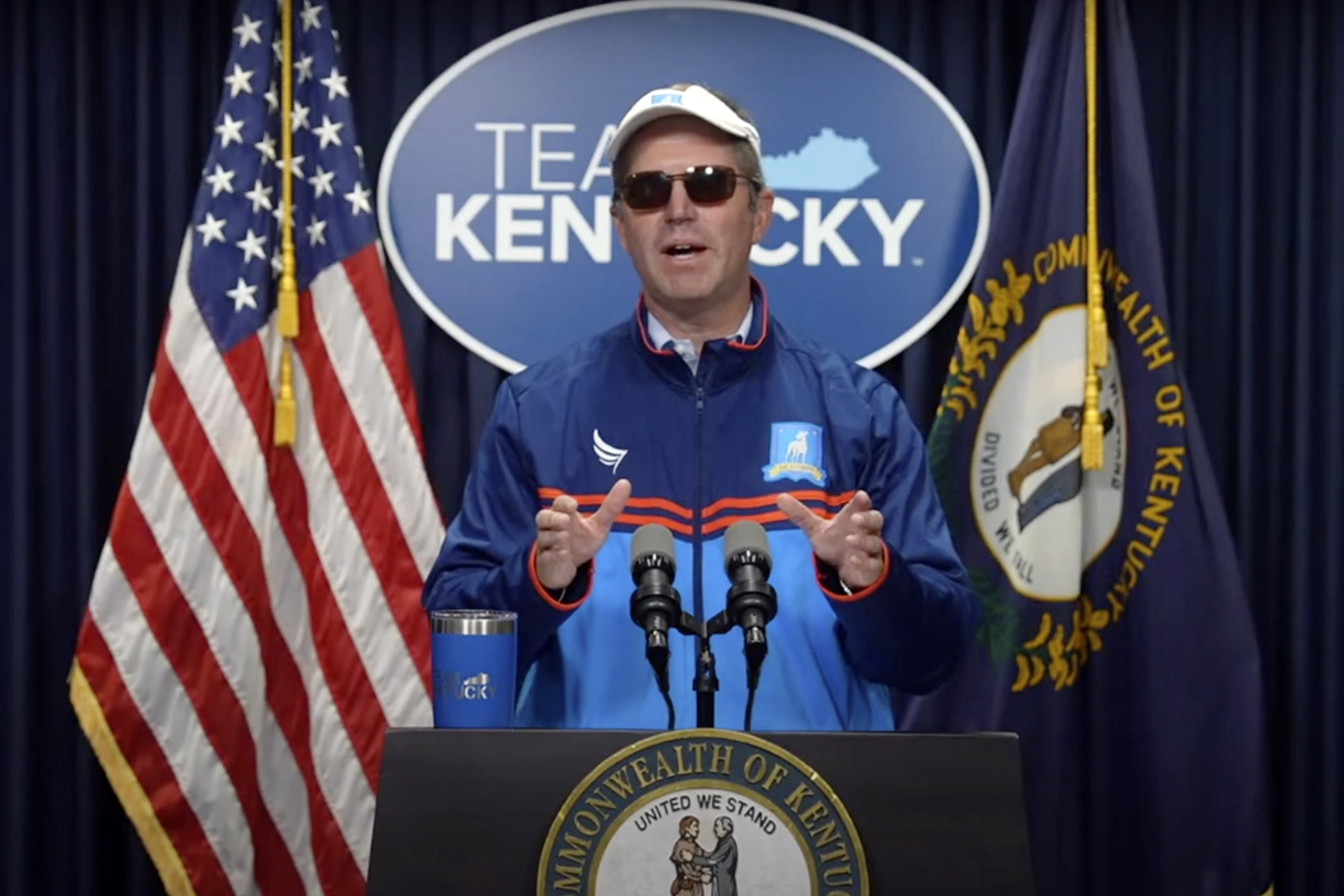 In this image taken from video provided by Kentucky Gov. Andy Beshear, Gov. Beshear shows off his Halloween spirit, decked out as fictional soccer coach Ted Lasso, during a press conference Thursday, Oct. 31, 2024, in Frankfort, Ky. (Kentucky Gov. Andy Beshear via AP)