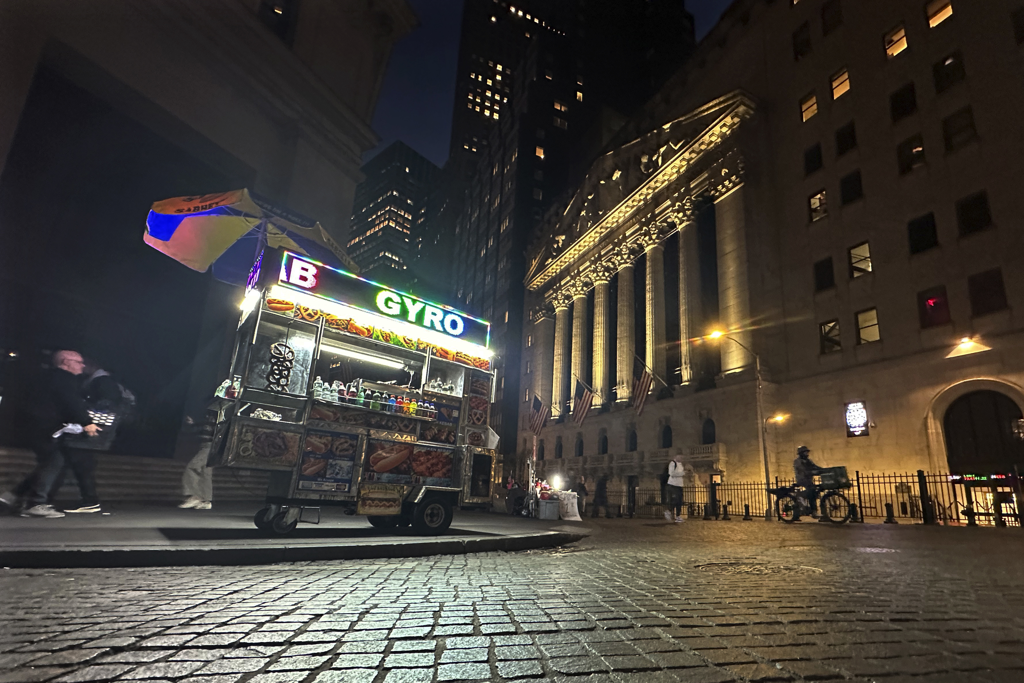 A food vendor's cart is parked across from the New York Stock Exchange on Wednesday, Oct. 30, 2024. (AP Photo/Peter Morgan)