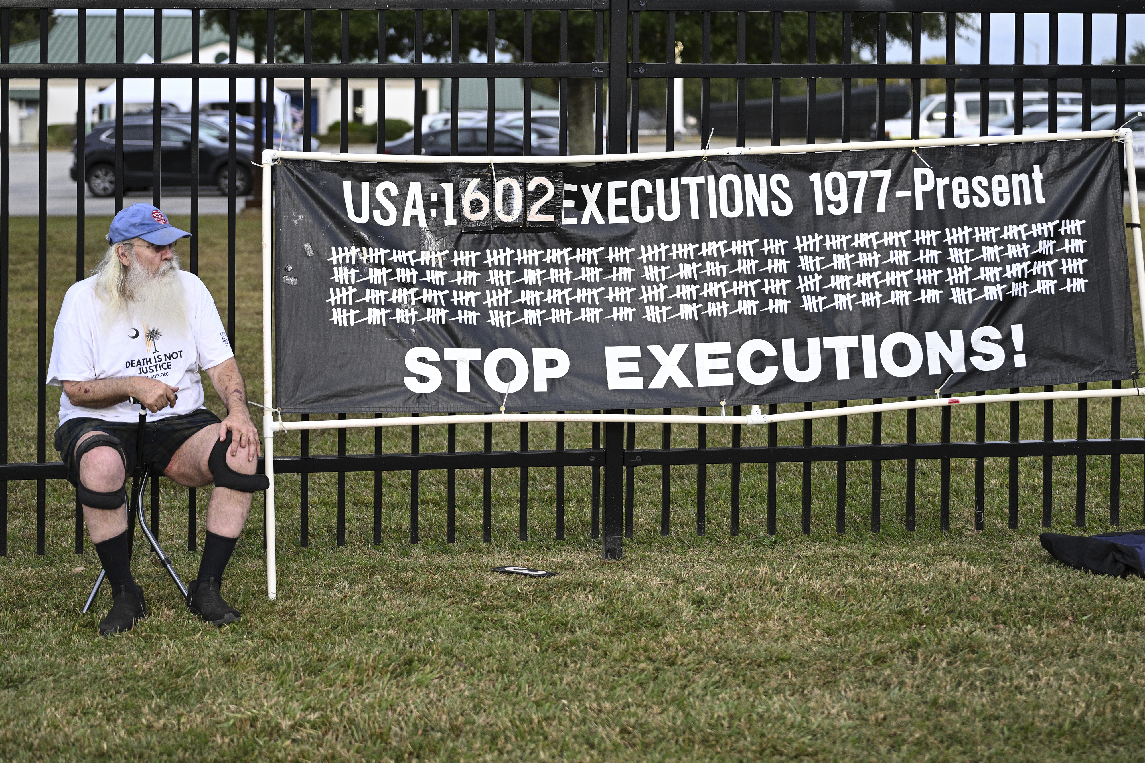 A protestor looks on prior to the scheduled execution of Richard Moore, Friday, Nov. 1, 2024, outside of Broad River Correctional Institution in Columbia , S.C. (AP Photo/Matt Kelley)