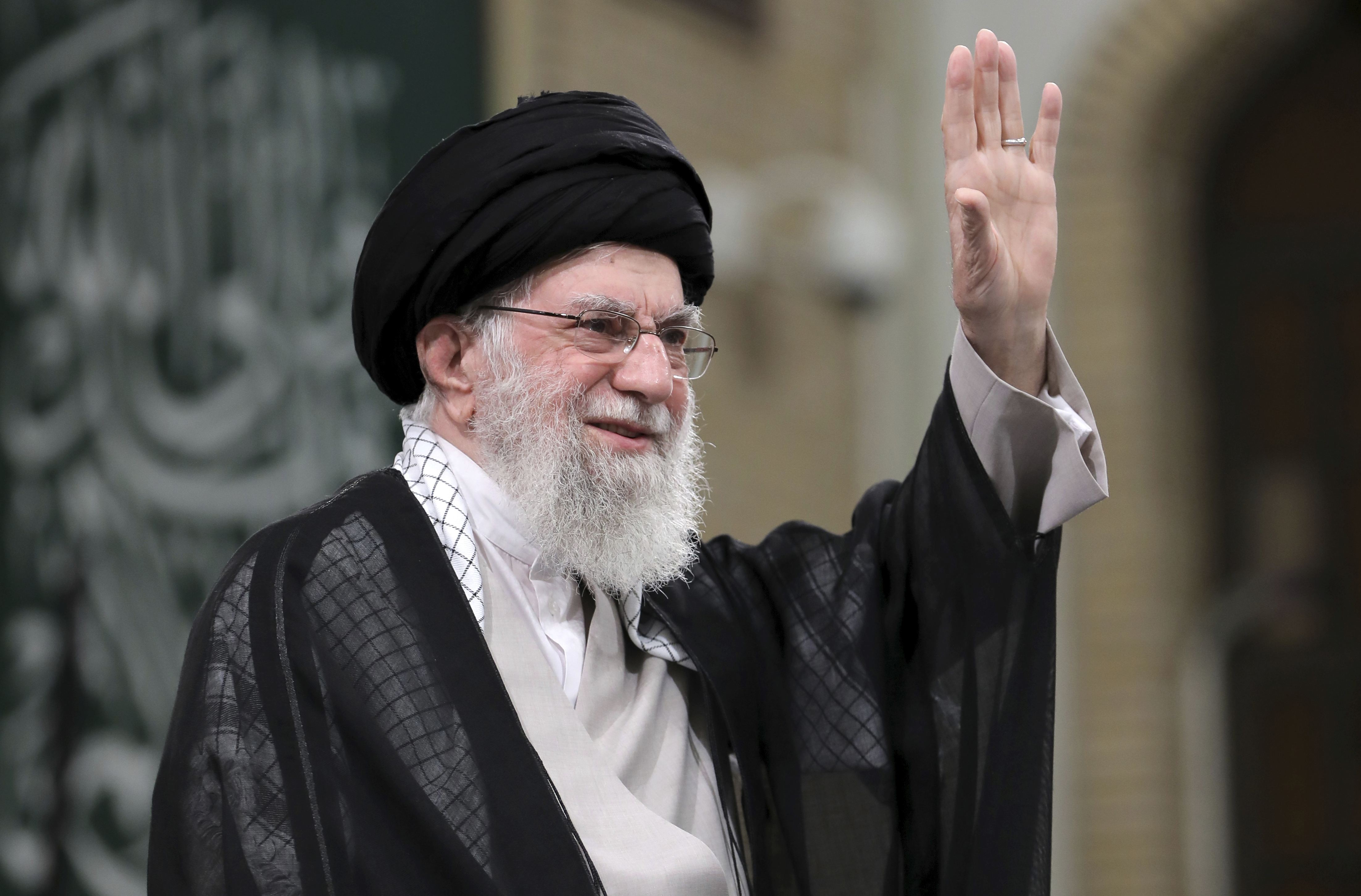 In this photo released by an official website of the office of the Iranian supreme leader, Supreme Leader Ayatollah Ali Khamenei waves to the crowd during a meeting with school and university students, in Tehran, Iran, Saturday, Nov. 2, 2024. (Office of the Iranian Supreme Leader via AP)