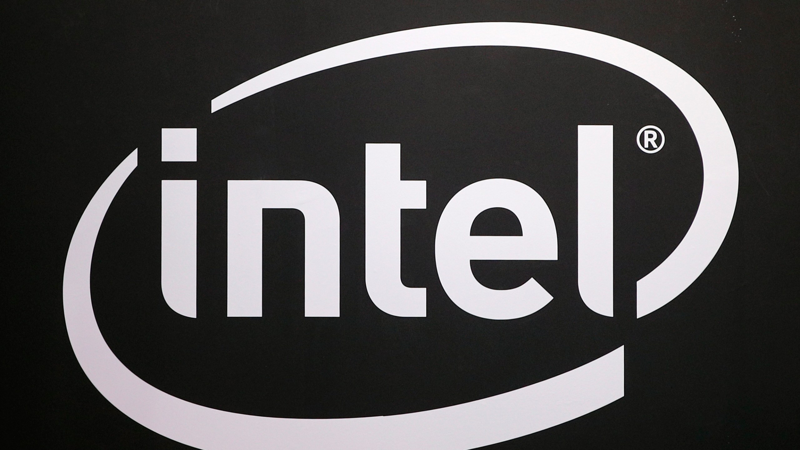 FILE -The logo of semiconductor chip maker Intel is pictured at the Paris games week in Paris, Nov. 4, 2017. (AP Photo/Christophe Ena, File)