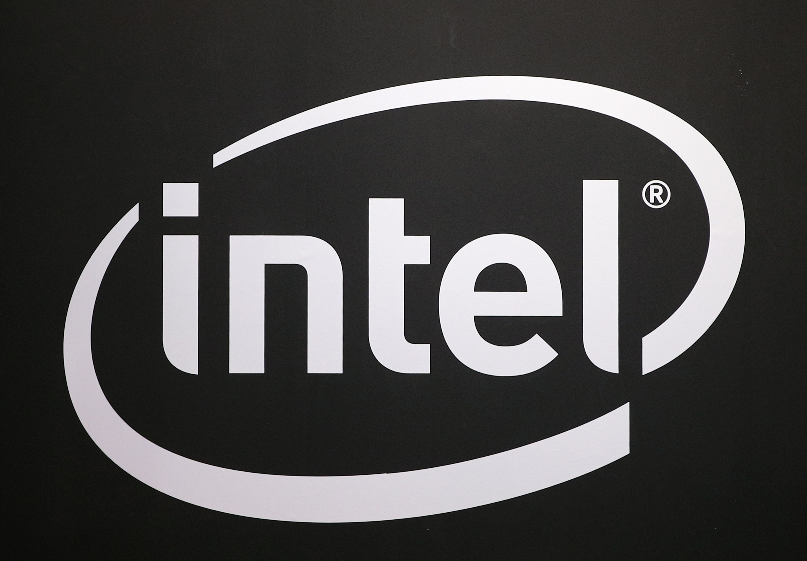 FILE -The logo of semiconductor chip maker Intel is pictured at the Paris games week in Paris, Nov. 4, 2017. (AP Photo/Christophe Ena, File)