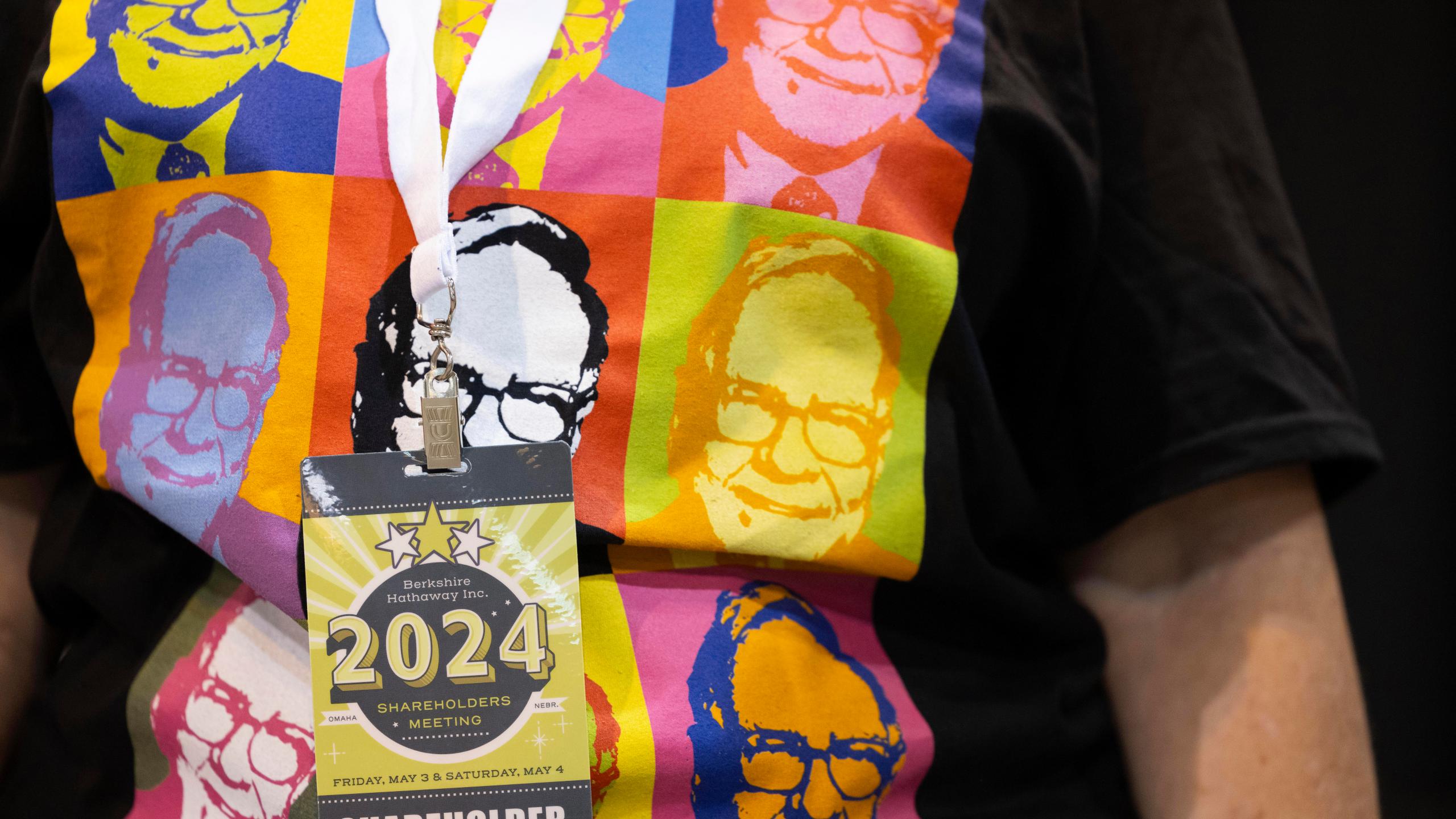 FILE - Shareholder Tina Schmidt of Cozad, Neb., wears a shirt with Warren Buffett's portrait in the style of an Andy Warhol painting at the Berkshire Hathaway annual meeting on May 4, 2024, in Omaha, Neb. (AP Photo/Rebecca S. Gratz, File)