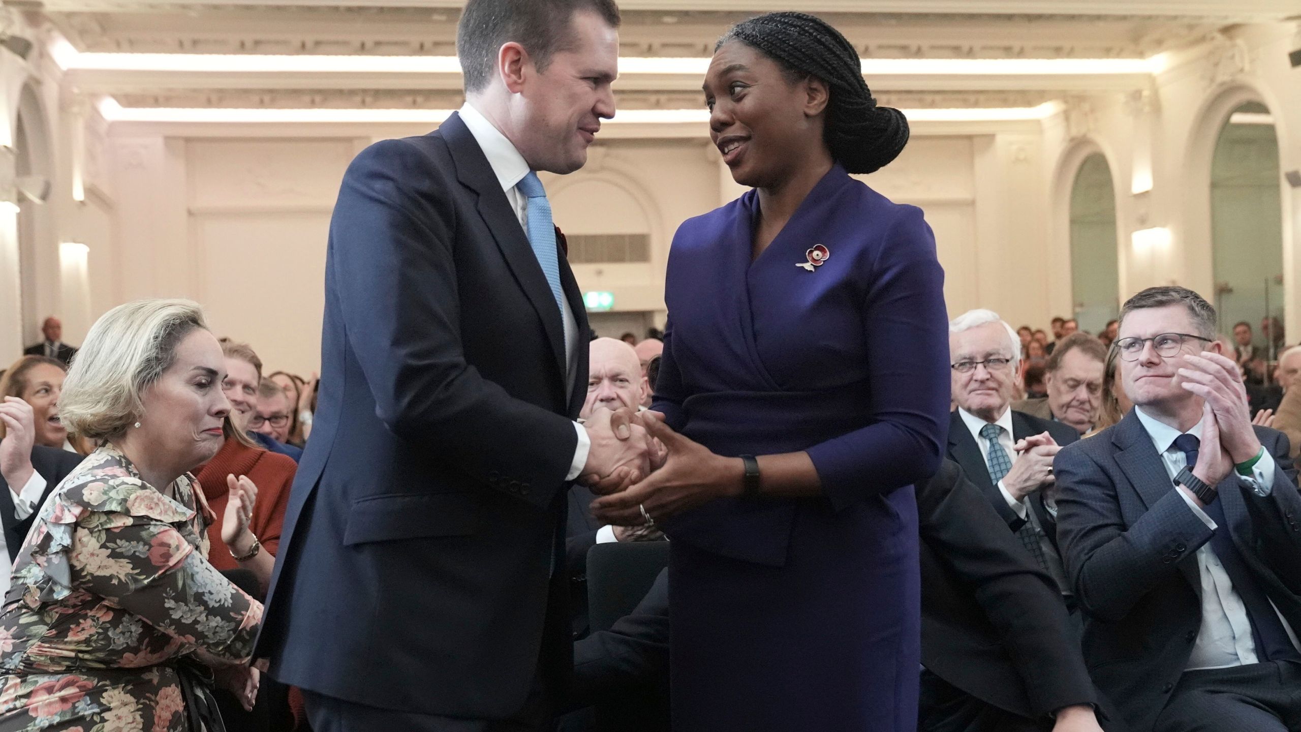 Britain's Member of Parliament Kemi Badenoch is congratulated by Robert Jenrick after being announced as the new Conservative Party leader following the vote by party members, at 8 Northumberland Avenue in central London, Saturday Nov. 2, 2024. (Stefan Rousseau/PA via AP)