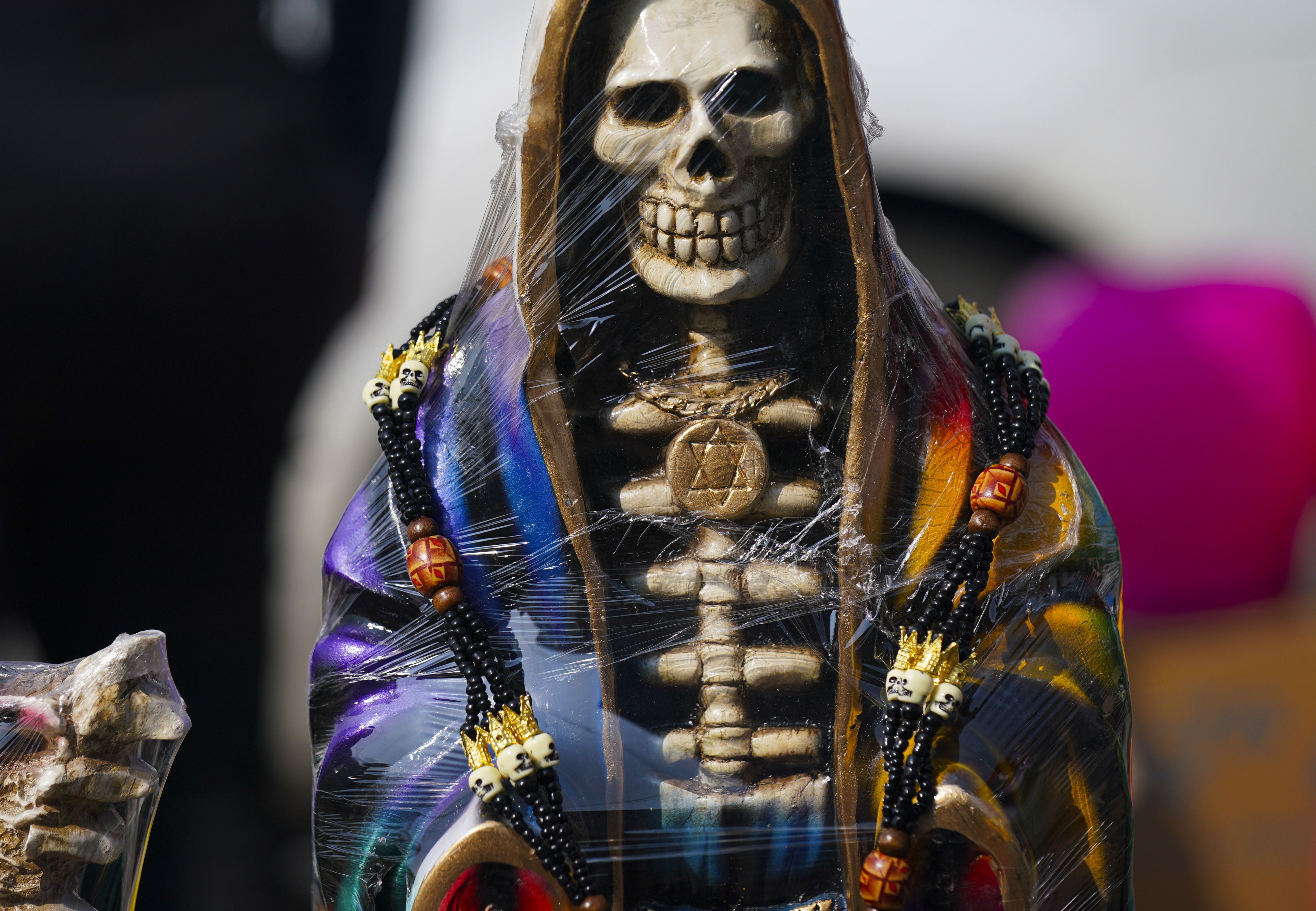 FILE - A statue of "Nuestra Señora de la Santa Muerte," or Our Lady of Holy Death, is displayed for sale in Mexico City's Tepito neighborhood, Nov. 1, 2022. (AP Photo/Fernando Llano, File)