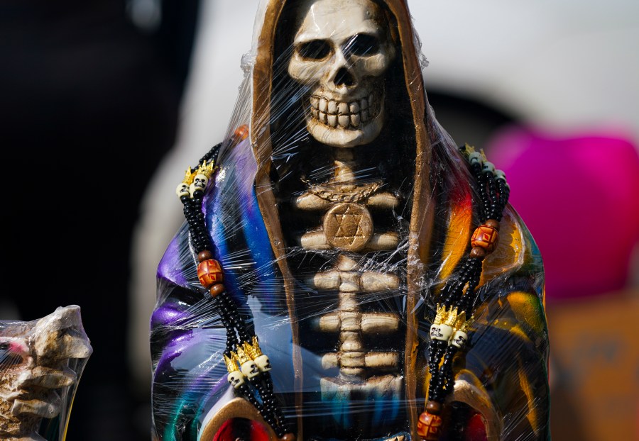 FILE - A statue of "Nuestra Señora de la Santa Muerte," or Our Lady of Holy Death, is displayed for sale in Mexico City's Tepito neighborhood, Nov. 1, 2022. (AP Photo/Fernando Llano, File)