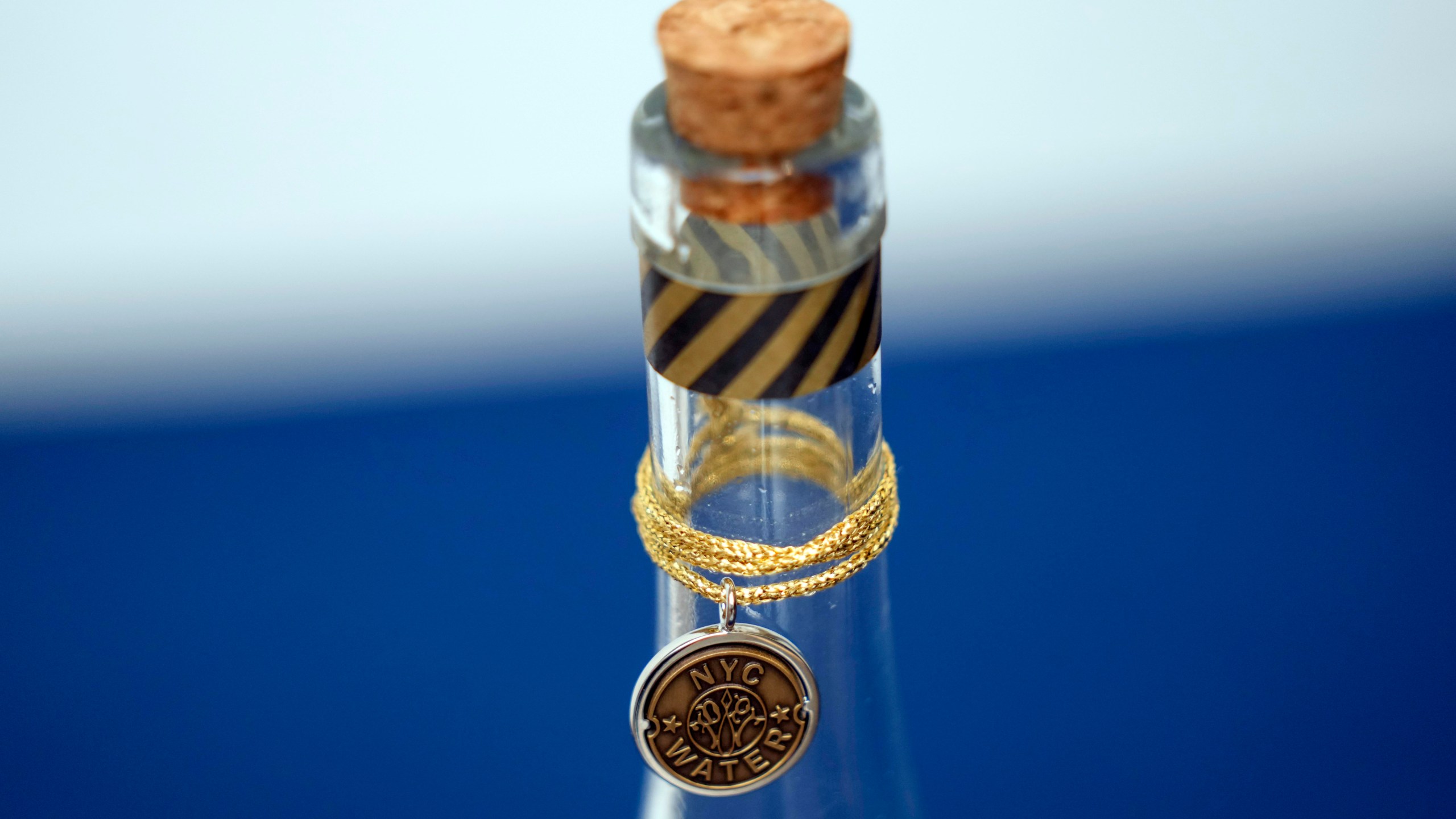 FILE - A bottle containing NYC tap water is displayed at a news conference about repairs occurring to the water supply infrastructure in New York, Sept. 30, 2024. (AP Photo/Seth Wenig, File)