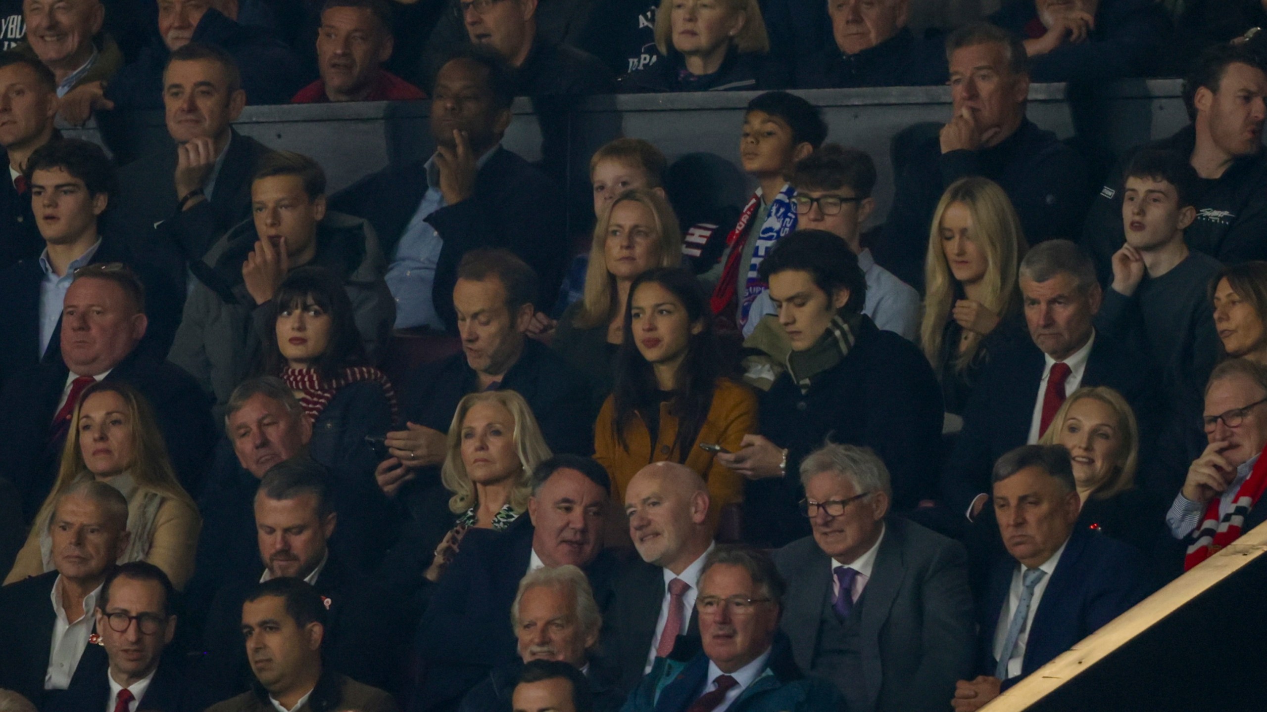 American singer-songwriter and actress Olivia Rodrigo, centre, attends the Premier League soccer match between Manchester United and Chelsea at Old Trafford stadium in Manchester, England, Sunday, Nov. 3, 2024. (AP Photo/Ian Hodgson)