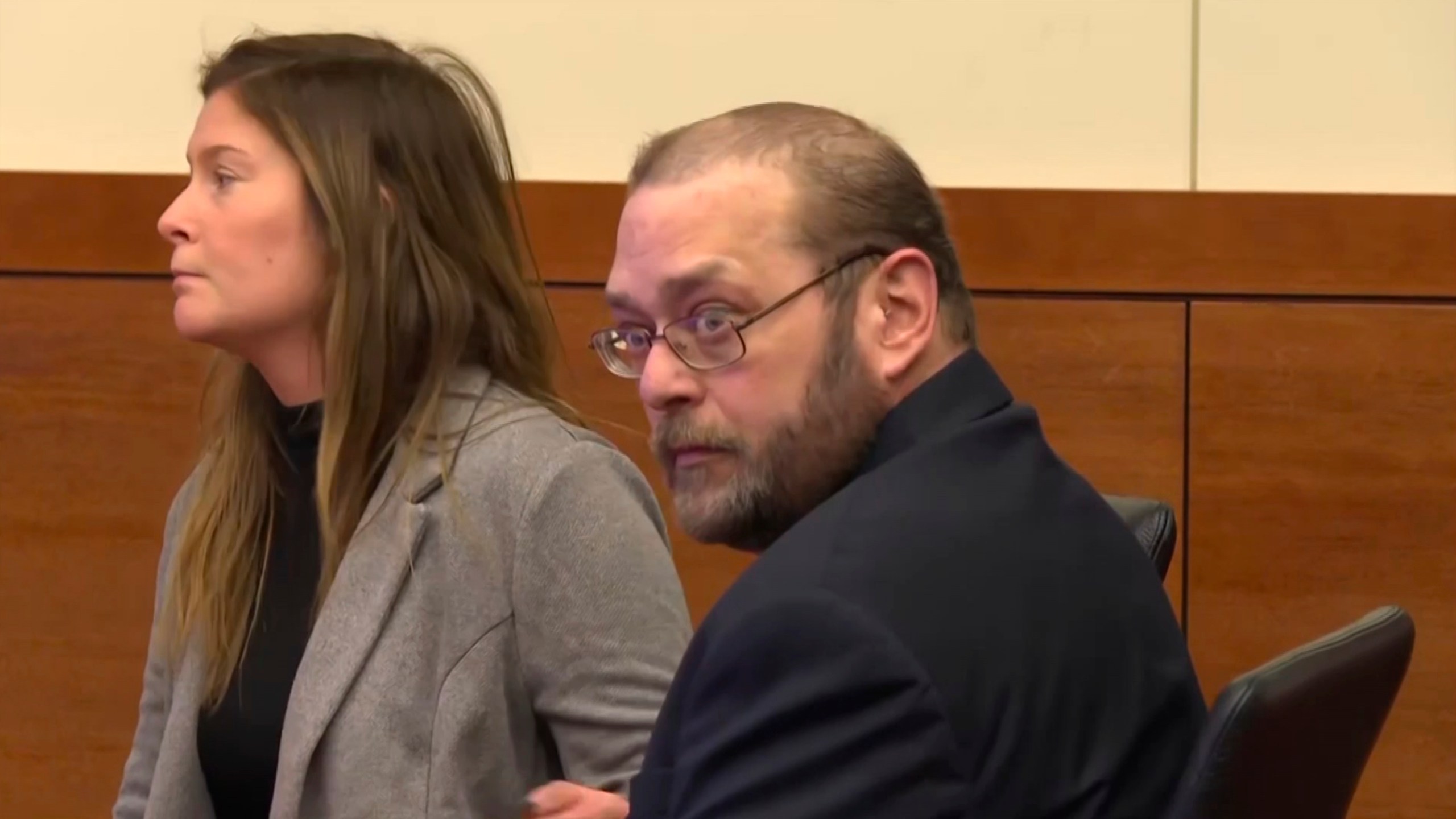 In this image from video, former police officer Adam Coy, left, sits in court in Columbus, Ohio, on Monday, Nov. 4, 2024, before the verdict is read in his trial over the shooting of Andre Hill, a Black man who was holding a cellphone and keys when he was killed. (WSYX/WTTE via AP, Pool)