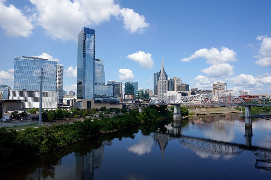 FILE - The Nashville, Tenn., skyline is reflected in the Cumberland River July 11, 2022. (AP Photo/Mark Humphrey, File)