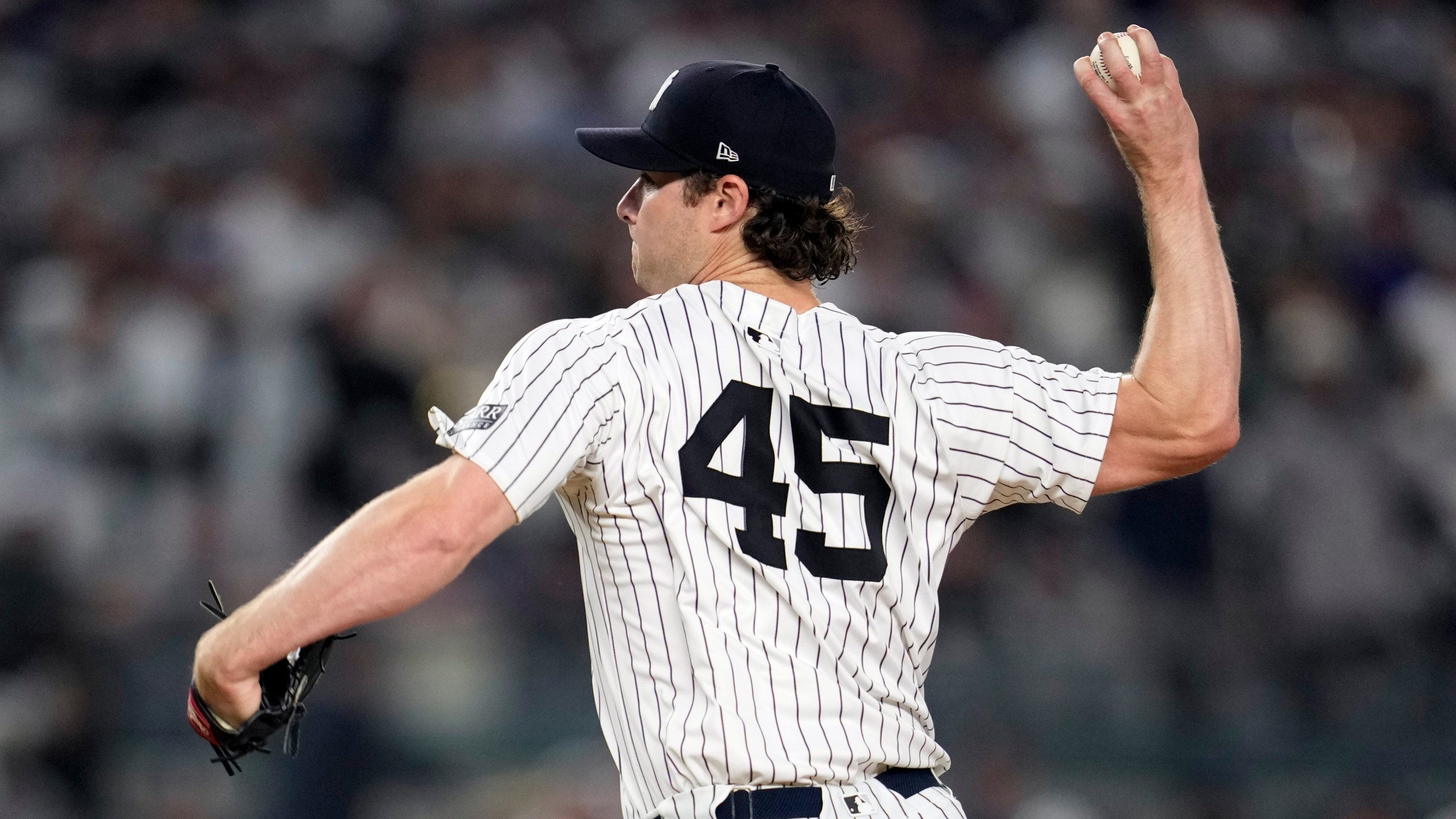 New York Yankees starting pitcher Gerrit Cole throws against the Los Angeles Dodgers during the first inning in Game 5 of the baseball World Series, Wednesday, Oct. 30, 2024, in New York. (AP Photo/Godofredo A. Vásquez)