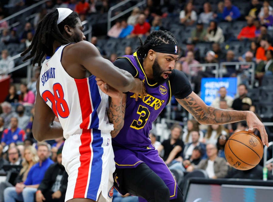 Detroit Pistons center Isaiah Stewart (28) guards Los Angeles Lakers forward Anthony Davis (3) during the first half of an NBA basketball game Monday, Nov. 4, 2024, in Detroit. (AP Photo/Duane Burleson)