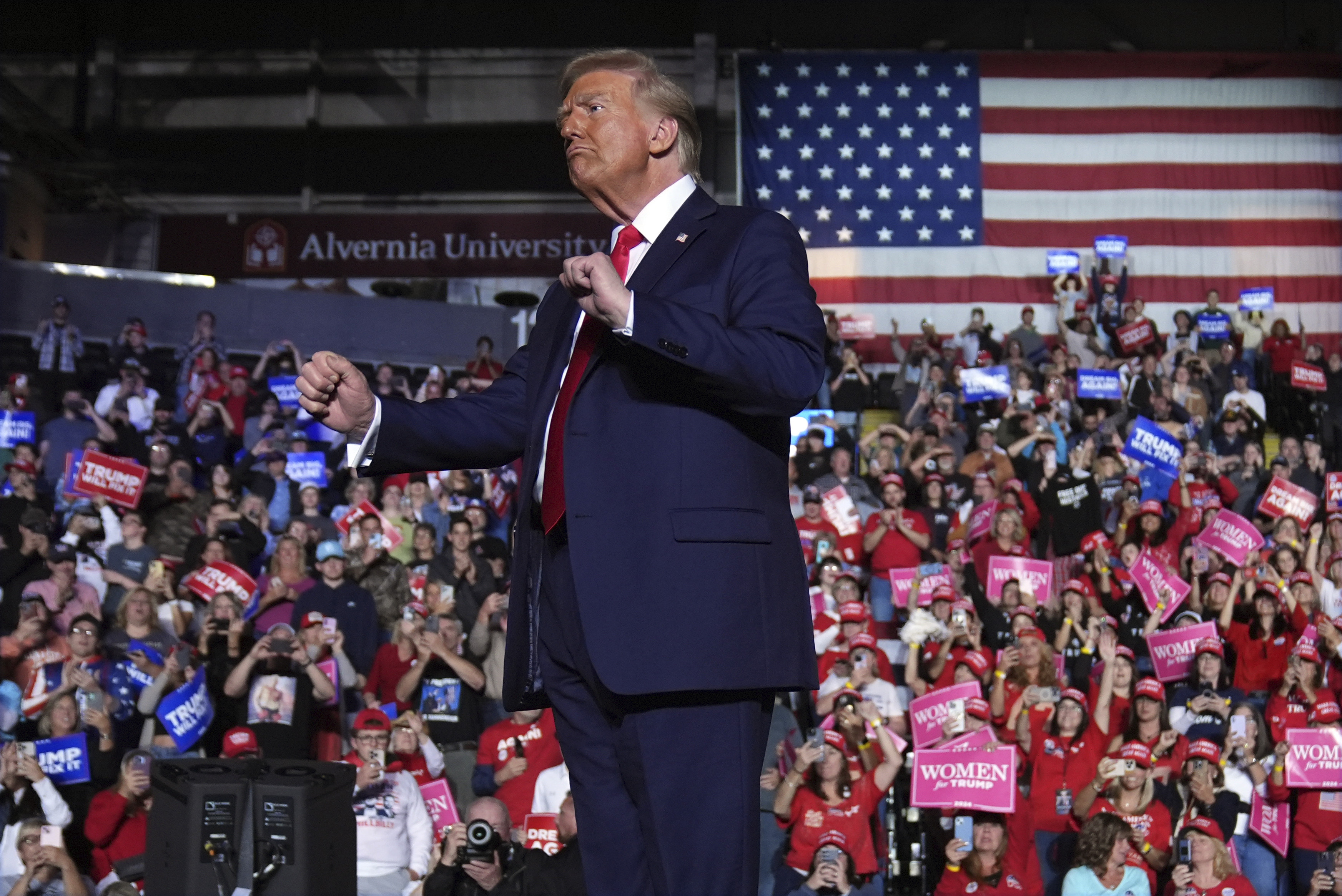 Republican presidential nominee former President Donald Trump dances during a campaign rally at Santander Arena, Monday, Nov. 4, 2024, in Reading, Pa. (AP Photo/Evan Vucci)