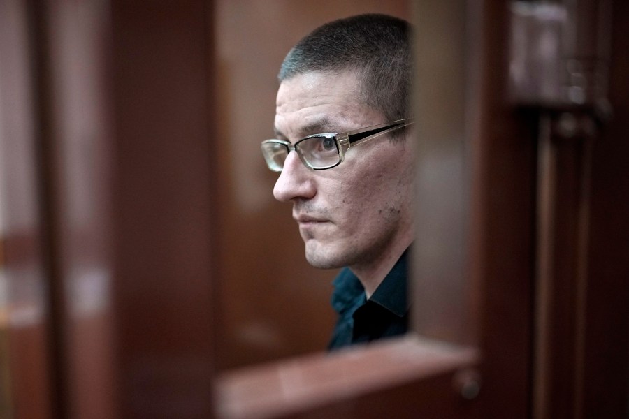 FILE -Robert Woodland, a Russia-born U.S. citizen, stands in a glass cage during a court hearing, July 4, 2024, in Moscow, Russia. (AP Photo/Alexander Zemlianichenko, File)