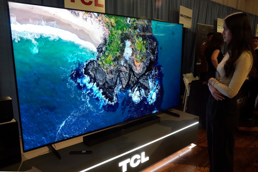 A 98-inch TCL QM-8 Q-Class Mini-LED QLED 4K HDR Smart TV is displayed at the Pepcom Holiday Spectacular event, in New York, Wednesday, Oct. 30, 2024. (AP Photo/Richard Drew)