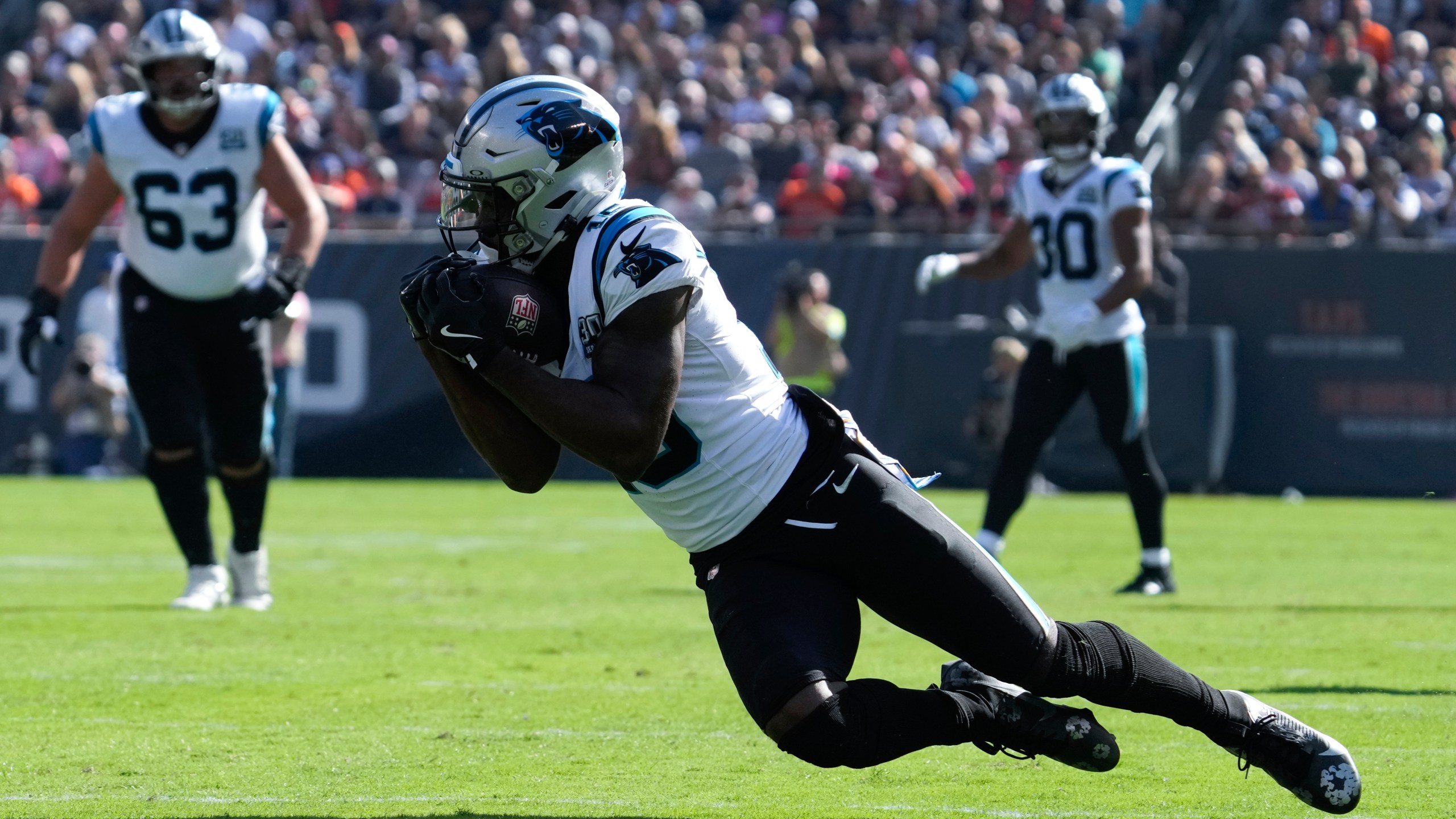 Carolina Panthers wide receiver Jonathan Mingo (15) catches a pass against the Chicago Bears during the second half of an NFL football game Sunday, Oct. 6, 2024, in Chicago. (AP Photo/Nam Y. Huh)