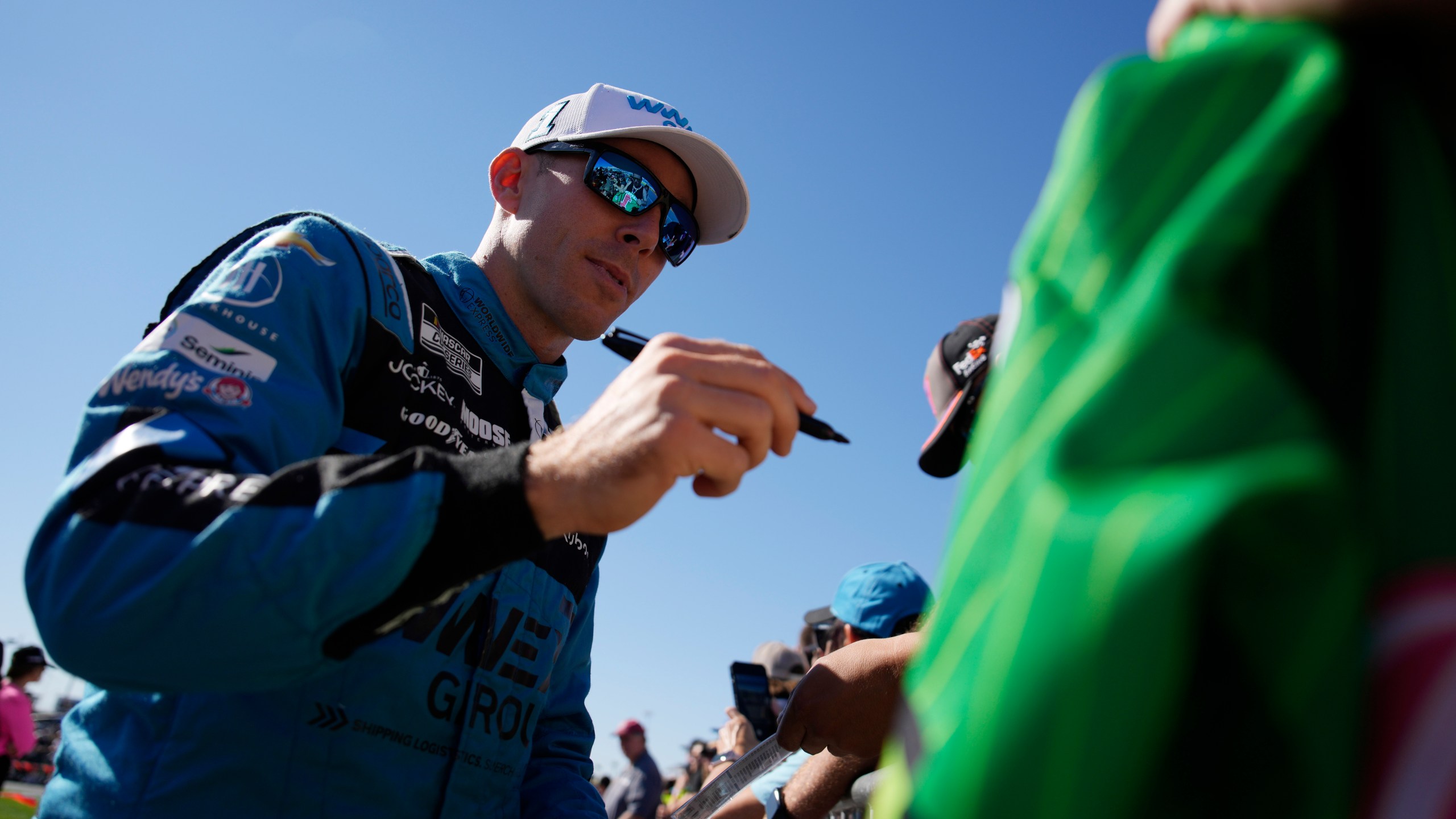 NASCAR Cup Series driver Ross Chastain signs autographs before a NASCAR Cup Series auto race Sunday, Oct. 20, 2024, in Las Vegas. (AP Photo/John Locher)