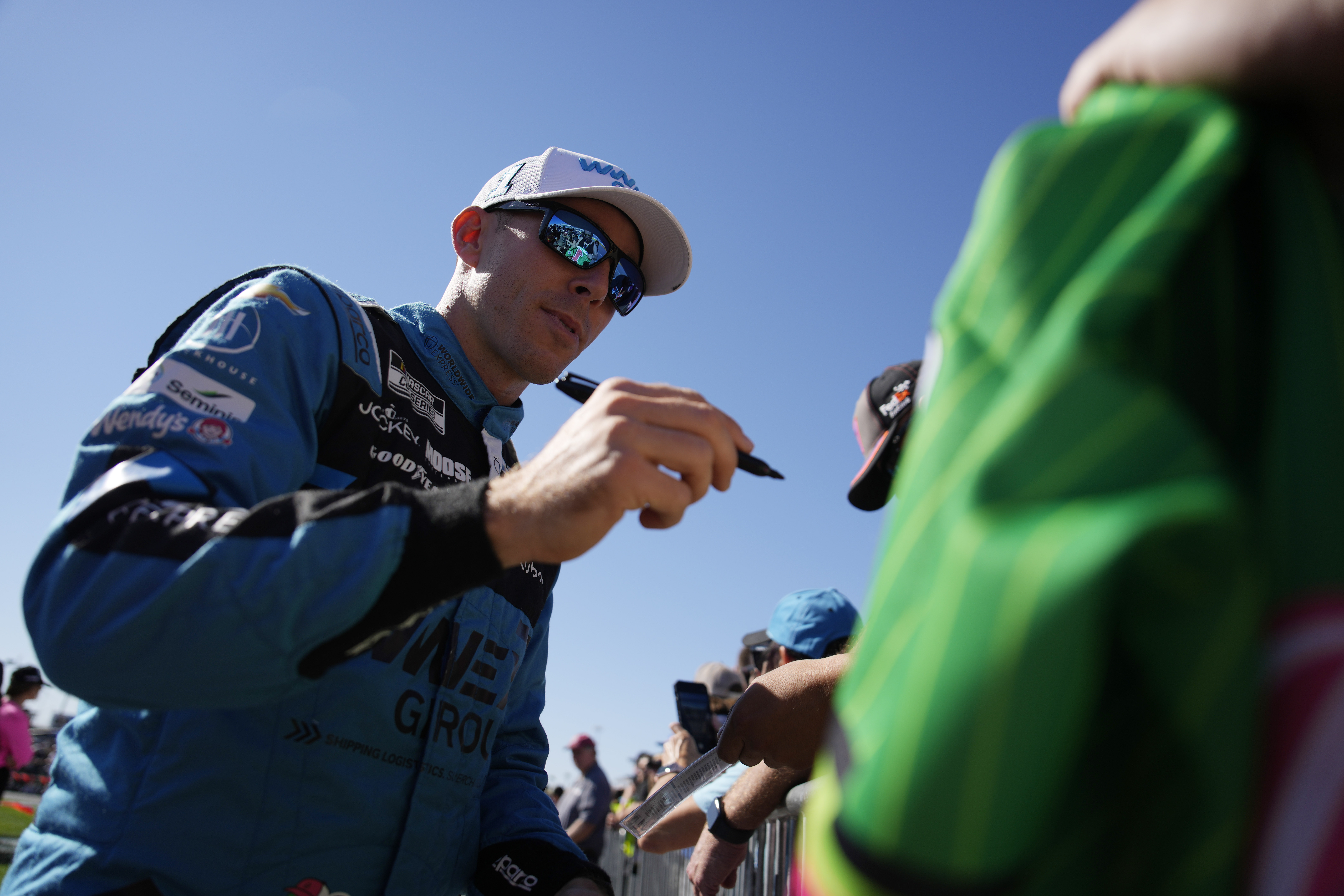 NASCAR Cup Series driver Ross Chastain signs autographs before a NASCAR Cup Series auto race Sunday, Oct. 20, 2024, in Las Vegas. (AP Photo/John Locher)