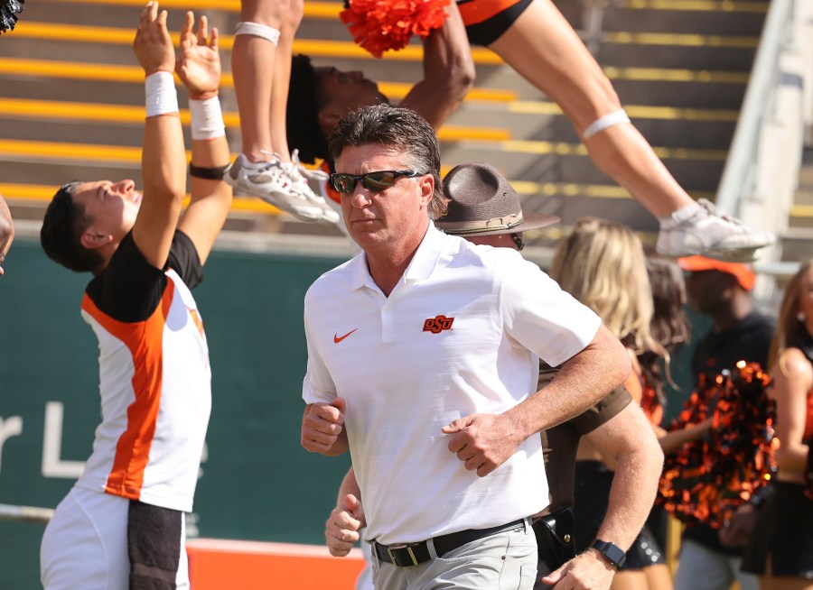 Oklahoma State head coach Mike Gundy runs on the field before an NCAA college football game against Baylor, Saturday, Oct. 26, 2024, in Waco, Texas. (Rod Aydelotte/Waco Tribune-Herald via AP)