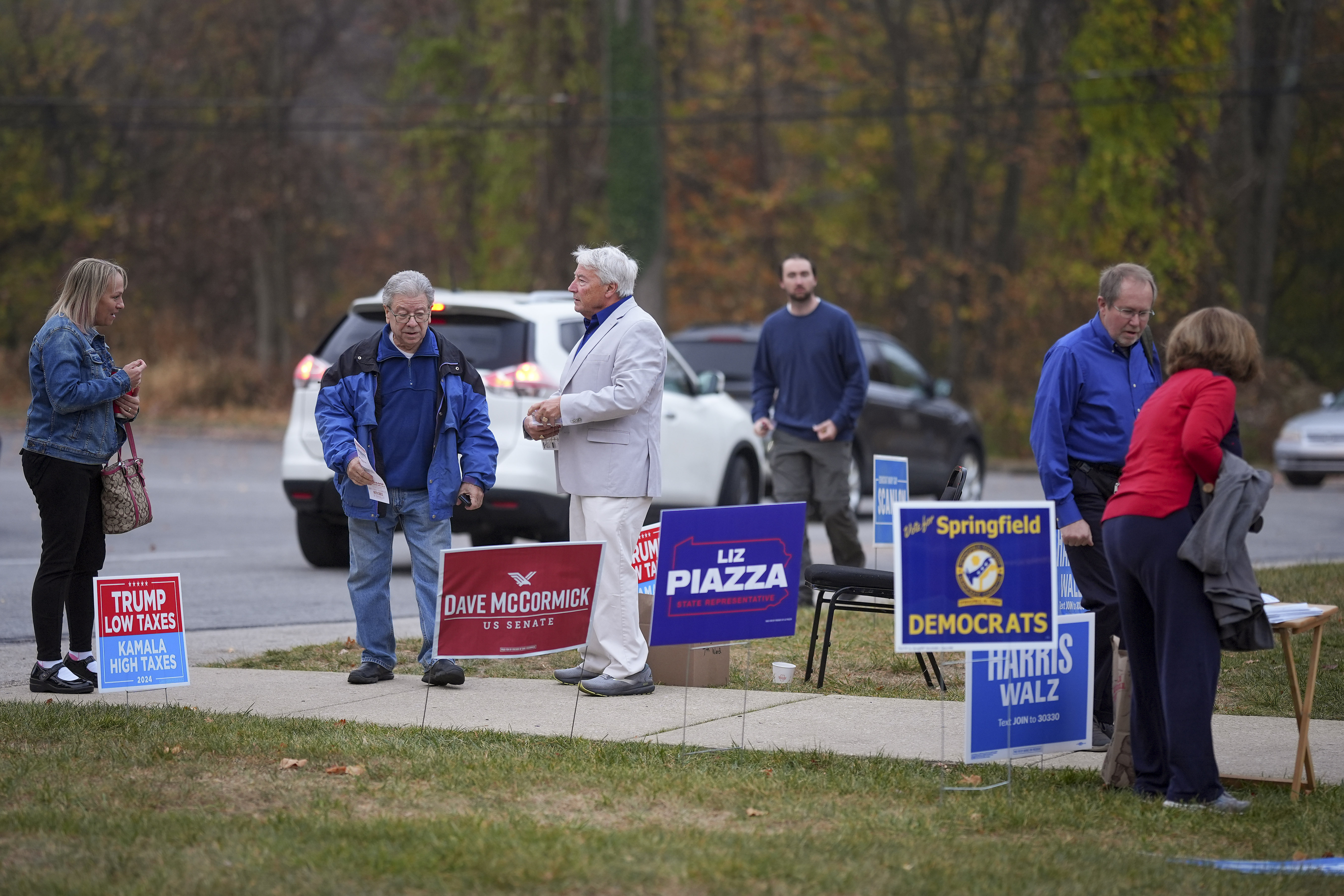 People arrive at polling place to vote, Tuesday, Nov. 5, 2024, in Springfield, Pa. (AP Photo/Matt Slocum)