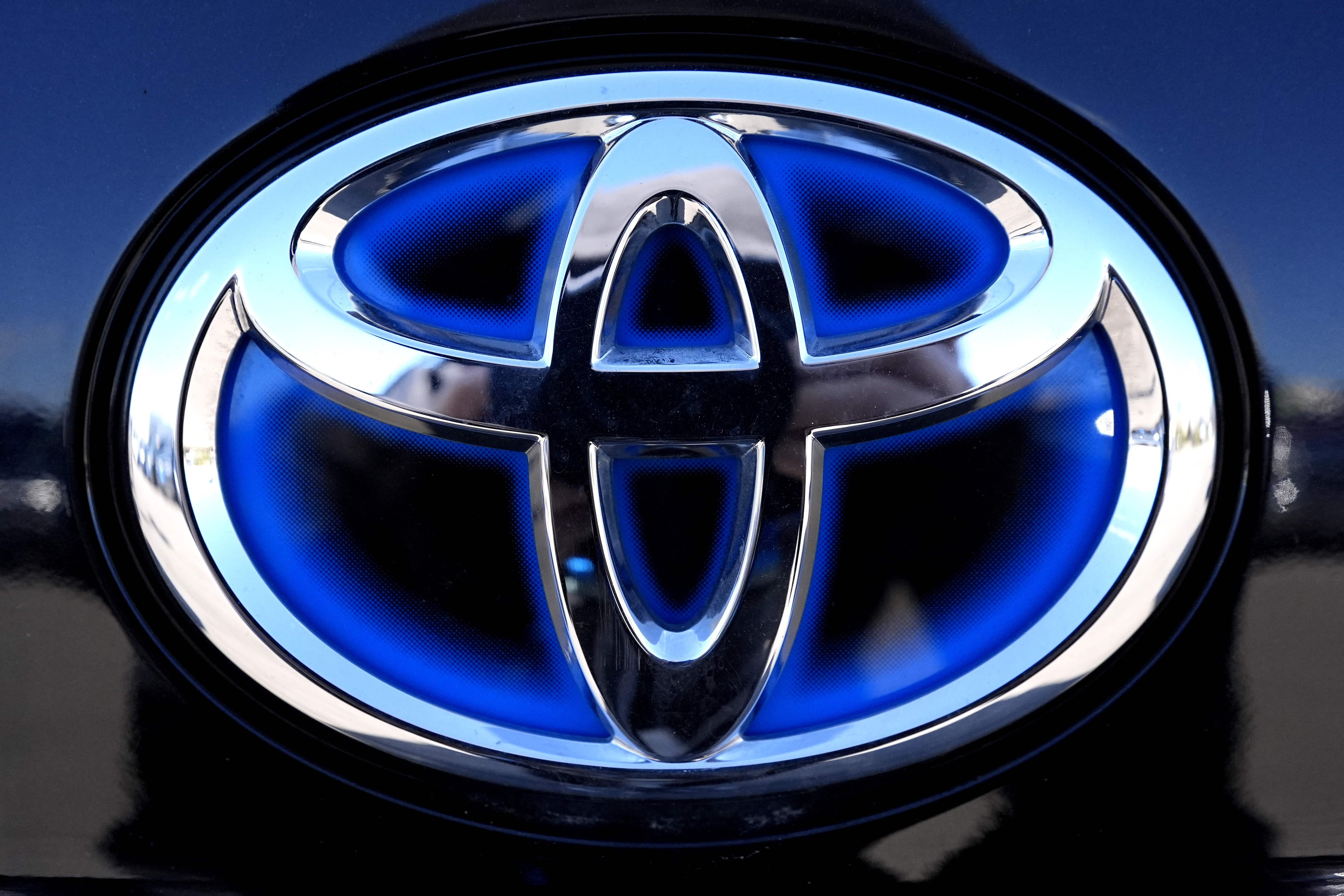 FILE - Toyota logo (Hybrid model) is seen at a new and used vehicles dealership in Palatine, Ill., Tuesday, March 20, 2024. (AP Photo/Nam Y. Huh, File)