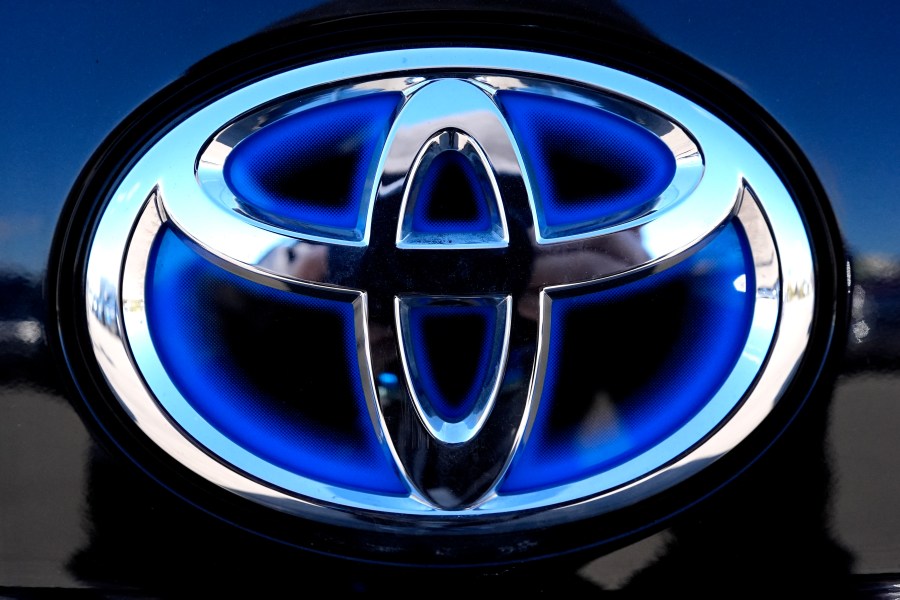 FILE - Toyota logo (Hybrid model) is seen at a new and used vehicles dealership in Palatine, Ill., Tuesday, March 20, 2024. (AP Photo/Nam Y. Huh, File)