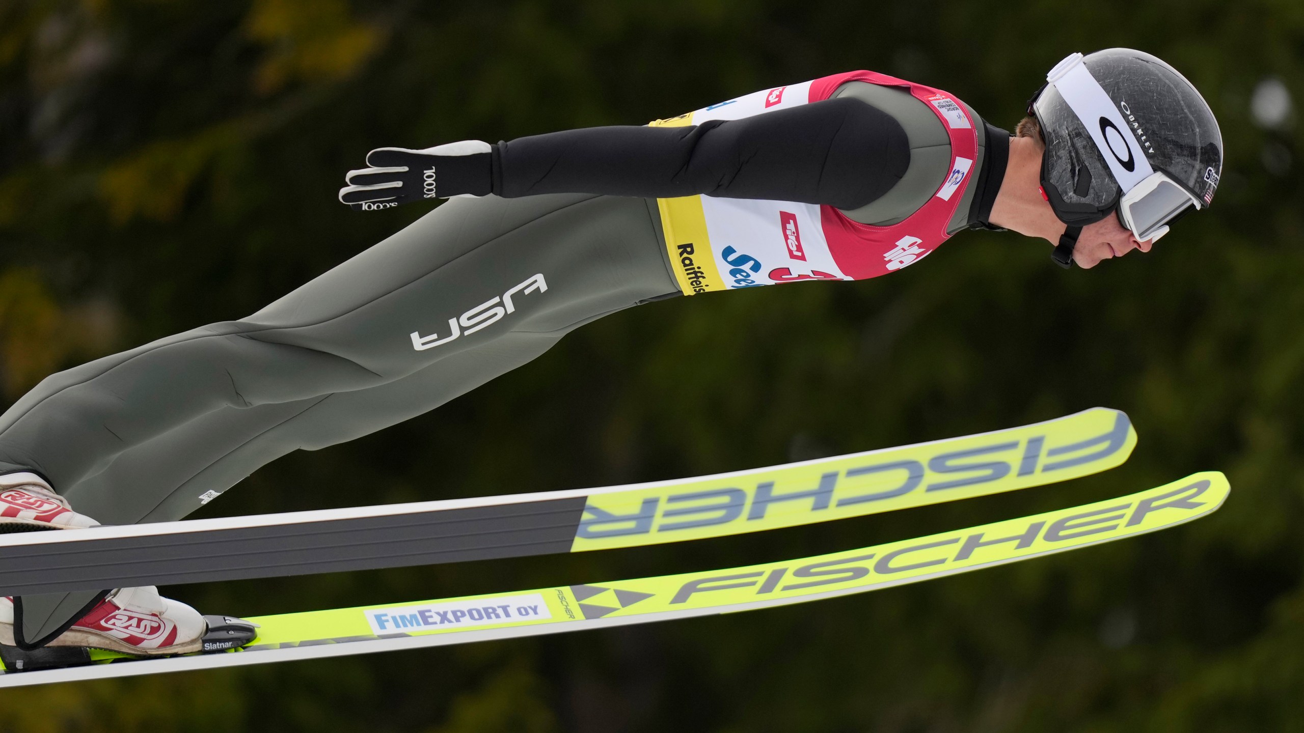 FILE - U.S. Niklas Malacinski competes during the men's Individual Gundersen Ski jumping at the Nordic Combined Triple World Cup in Seefeld, Austria, Feb. 2, 2024. (AP Photo/Matthias Schrader, File)