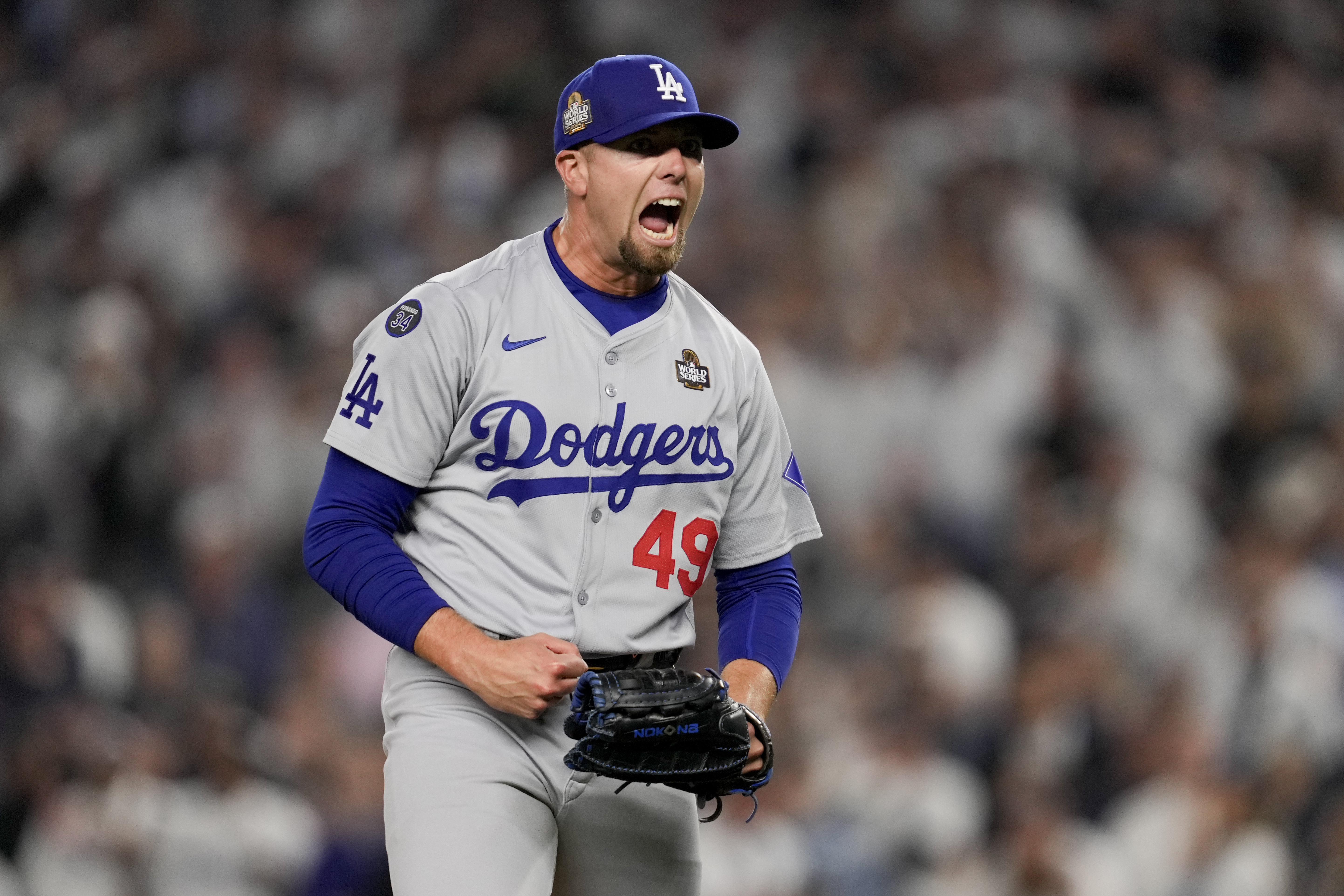 Los Angeles Dodgers pitcher Blake Treinen celebrates the end of the eighth inning in Game 5 of the baseball World Series against the New York Yankees, Wednesday, Oct. 30, 2024, in New York. (AP Photo/Ashley Landis)