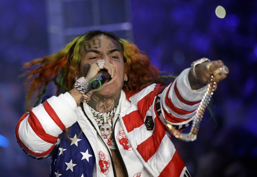 FILE- Rapper Daniel Hernandez, known as Tekashi 6ix9ine, performs during the Philipp Plein women's 2019 Spring-Summer collection, unveiled during the Fashion Week in Milan, Italy, Sept. 21, 2018. (AP Photo/Luca Bruno, File)