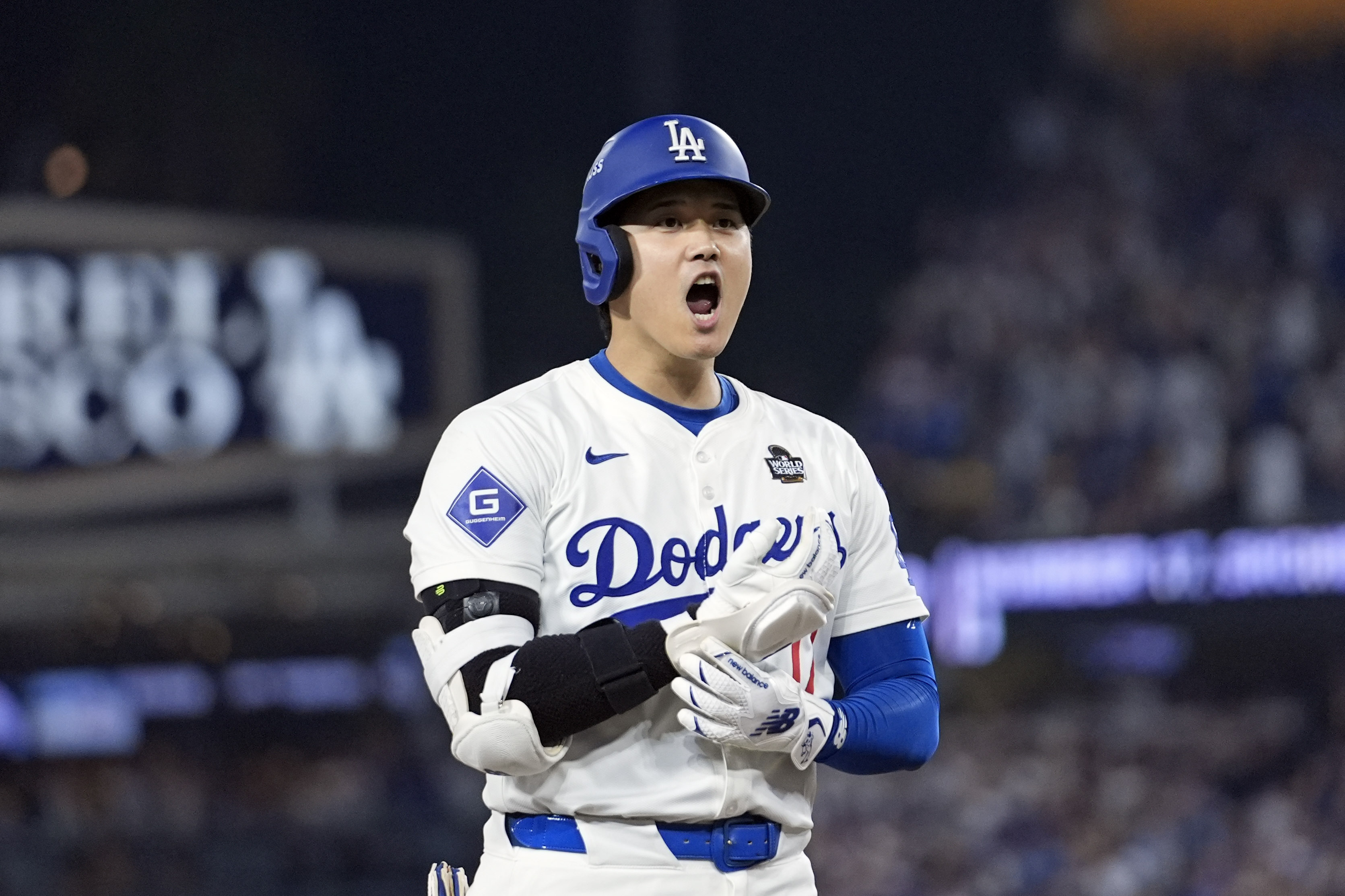 Los Angeles Dodgers' Shohei Ohtani reacts after advancing to third on a fielding error by New York Yankees second baseman Gleyber Torres during the eighth inning in Game 1 of the baseball World Series, Friday, Oct. 25, 2024, in Los Angeles. (AP Photo/Godofredo A. Vásquez)