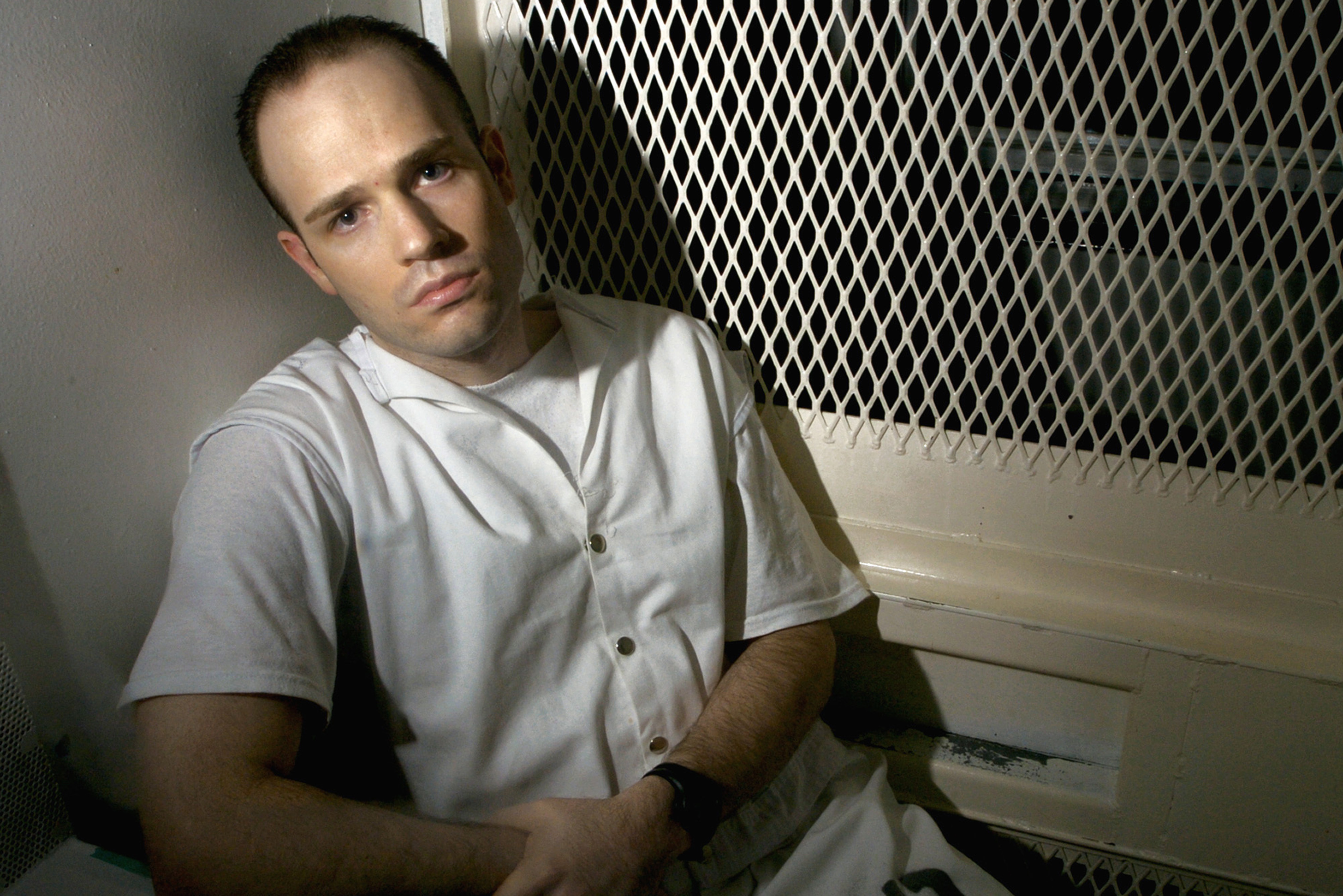 FILE - Death row inmate Randy Halprin, then 26, sits in a visitation cell at the Polunsky Unit in Livingston, Texas, Dec. 3, 2003. (AP Photo/Brett Coomer, File)