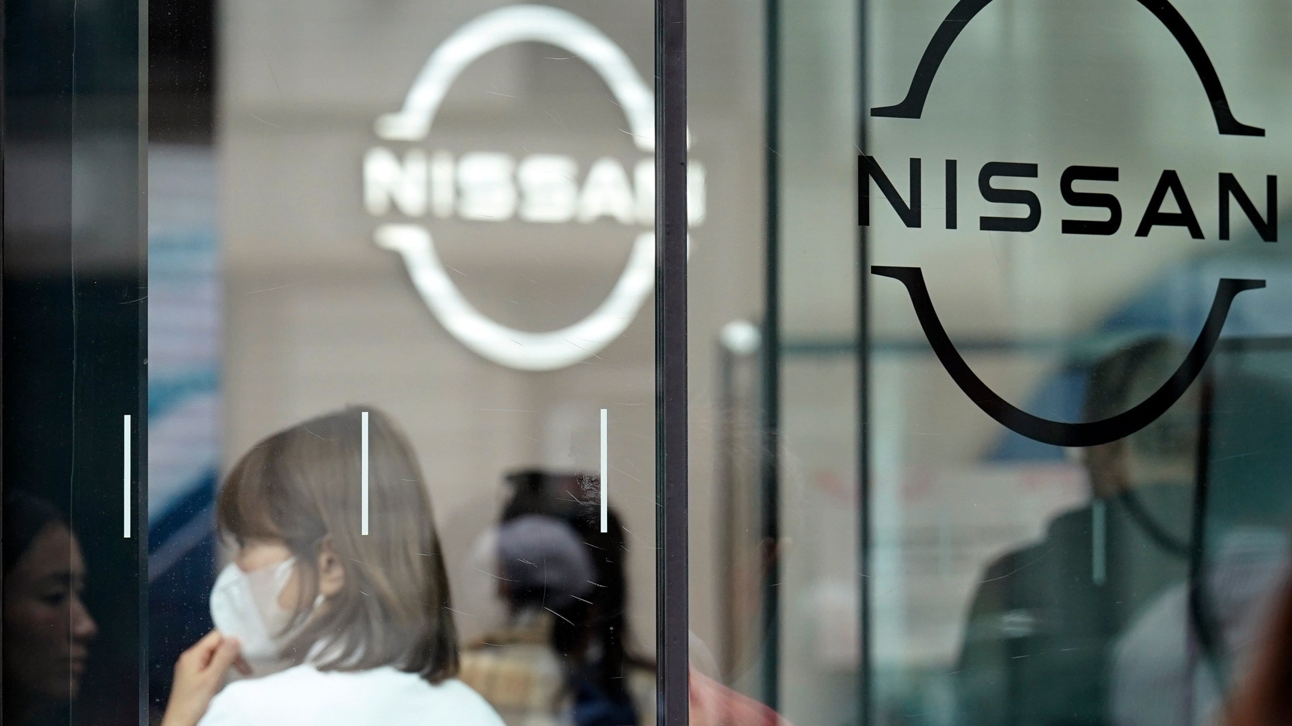 FILE - Logos at a Nissan showroom are seen in Ginza shopping district in Tokyo, on March 31, 2023. (AP Photo/Eugene Hoshiko, File)