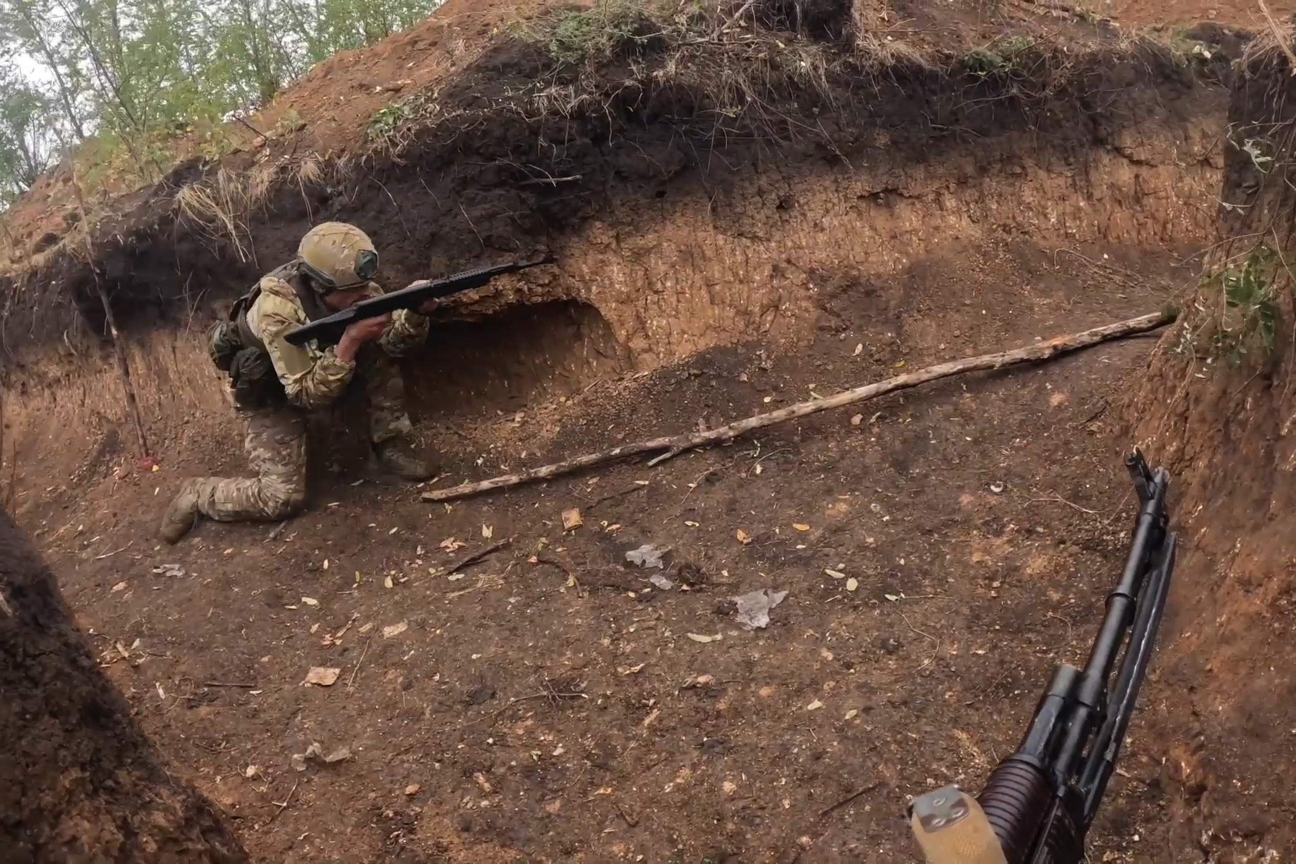 In this photo taken from a bodycam video released by Russian Defense Ministry press service on Thursday, Nov. 7, 2024, a Russian servicemen takes part in a combat training for assault units at an undisclosed location in Ukraine. (Russian Defense Ministry Press Service via AP)