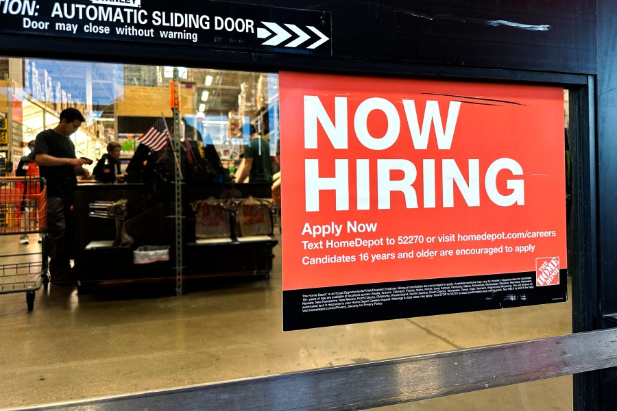 A hiring sign is displayed at a retail store in Mount Prospect, Ill., Saturday, Nov. 2, 2024. (AP Photo/Nam Y. Huh)