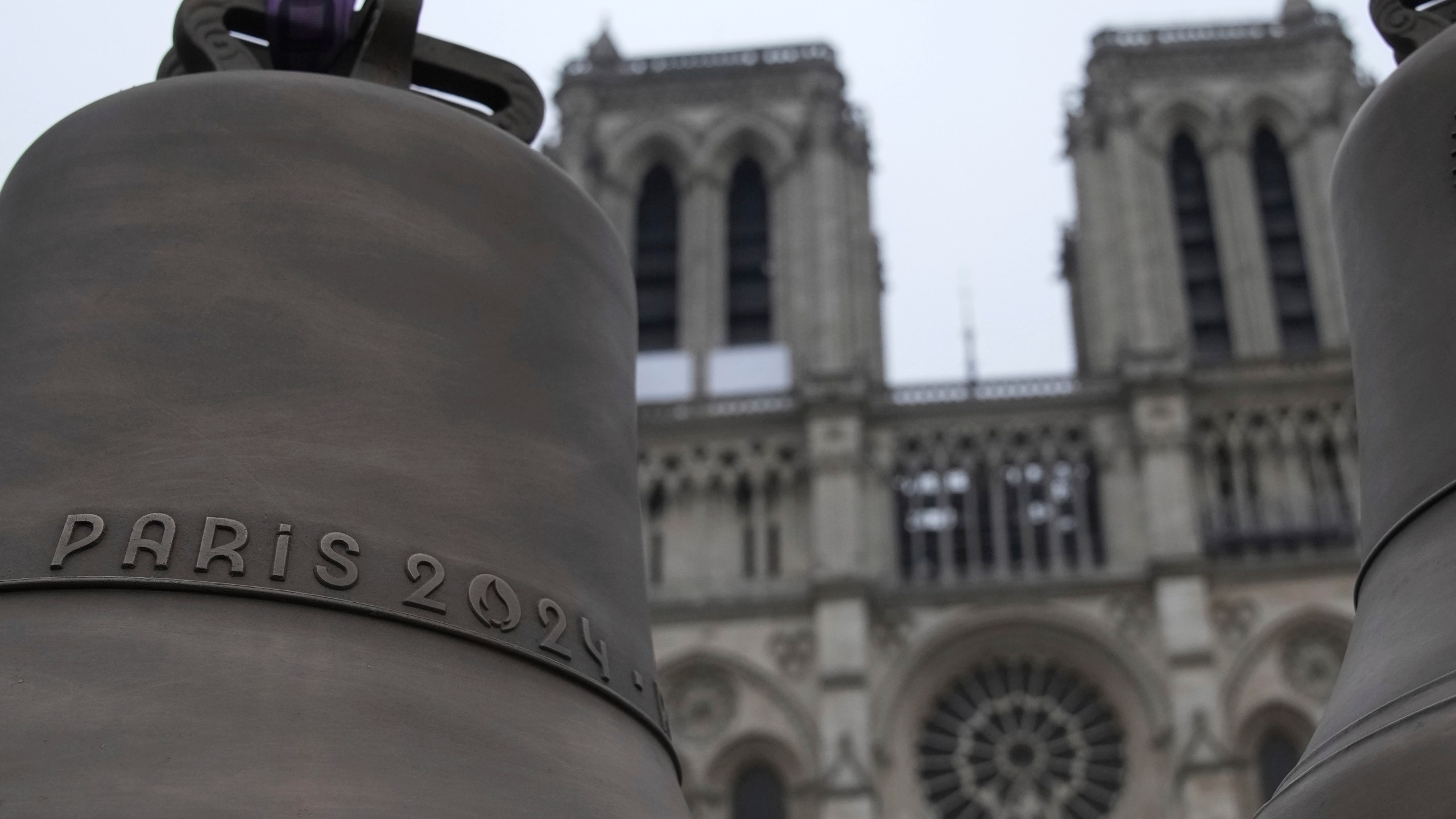 The bell that Olympic medalists rang at the Paris Games, left, and another bell are seen before their installation in Notre-Dame cathedral, ahead of the monument's grandiose reopening following a massive fire and five-year reconstruction effort, Thursday, Nov. 7, 2024 in Paris. (AP Photo/Christophe Ena)