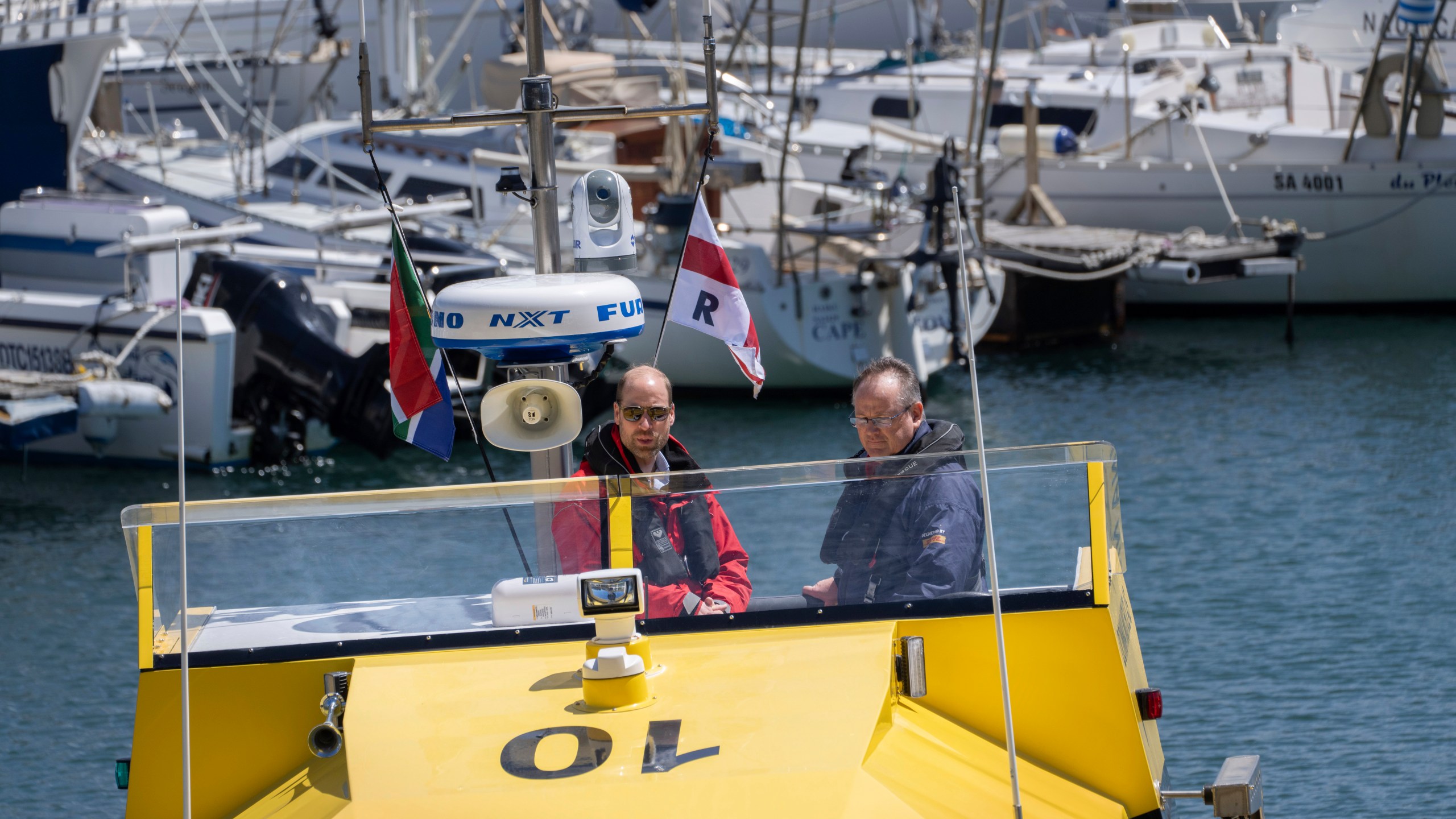 Britain's Prince William sails off with volunteers of the National Sea Rescue Initiative, at Simon's Town harbour near Cape Town, South Africa, Thursday, Nov. 7, 2024. (AP Photo/Jerome Delay, Pool)