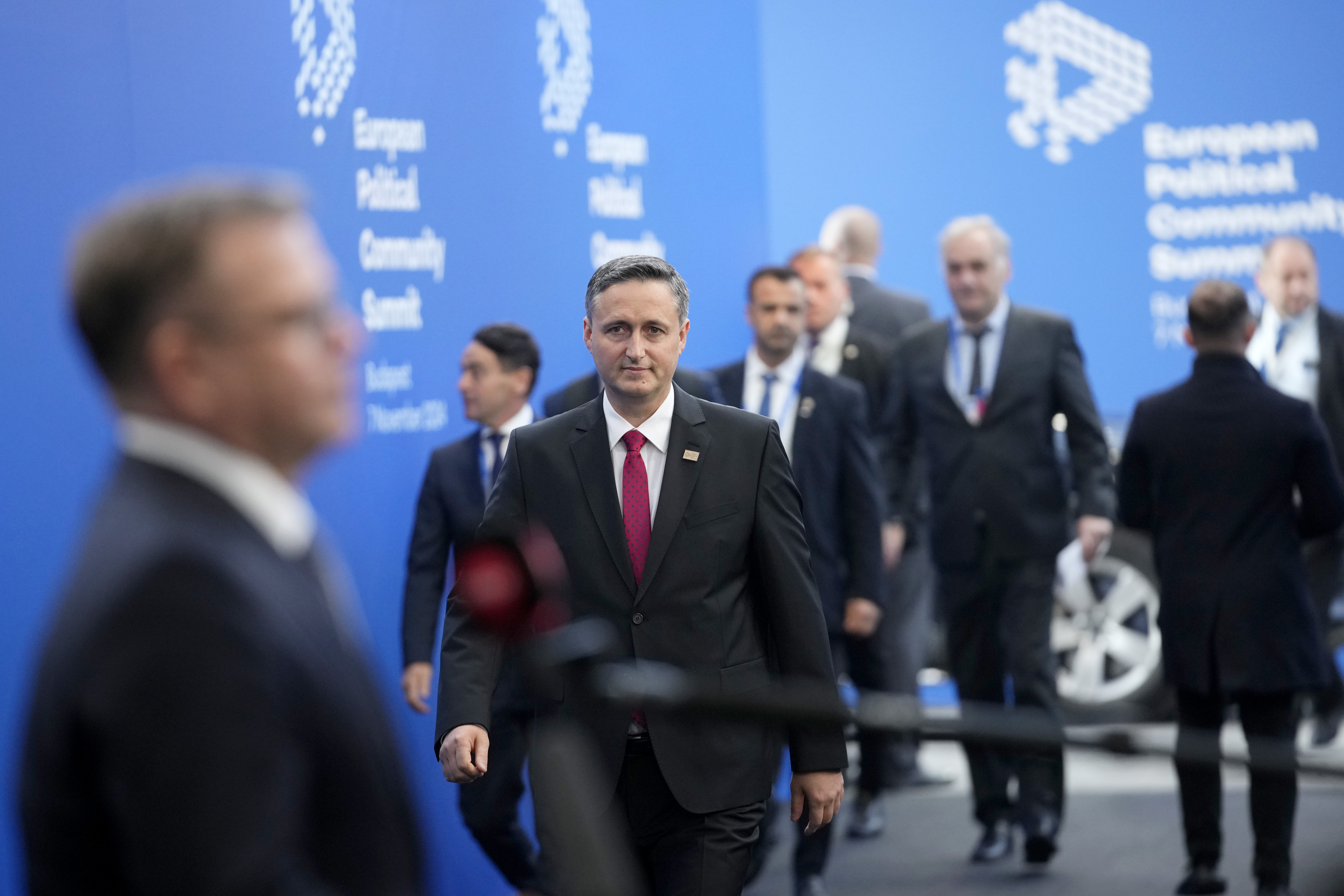 Chairman of the Presidency of Bosnia and Herzegovina Denis Becirovic, center, arrives for the European Political Community (EPC) Summit at the Puskas Arena in Budapest, Hungary, Thursday, Nov. 7, 2024. (AP Photo/Petr Josek)