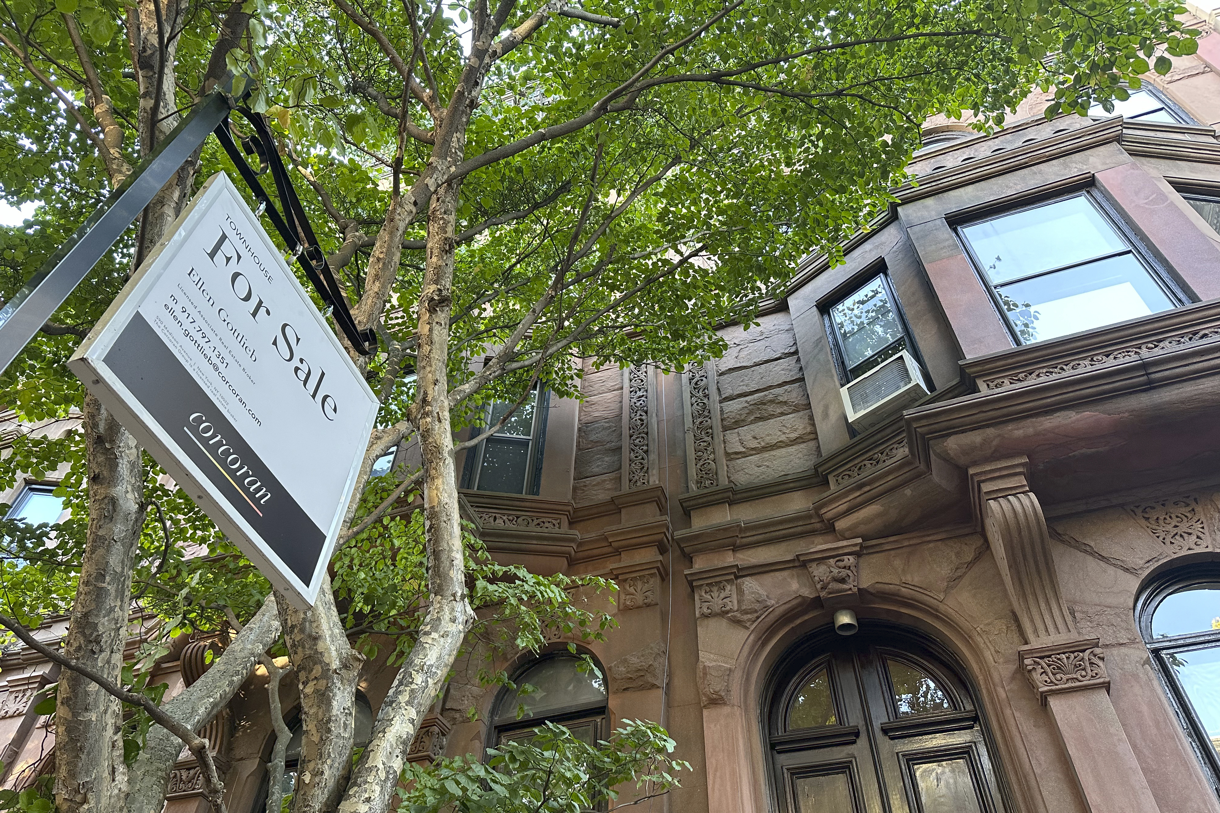 FILE - A for sale sign hangs in front of a home in the Park Slope neighborhood in the borough of Brooklyn in New York on Oct. 10, 2024. (AP Photo/Peter Morgan, File)